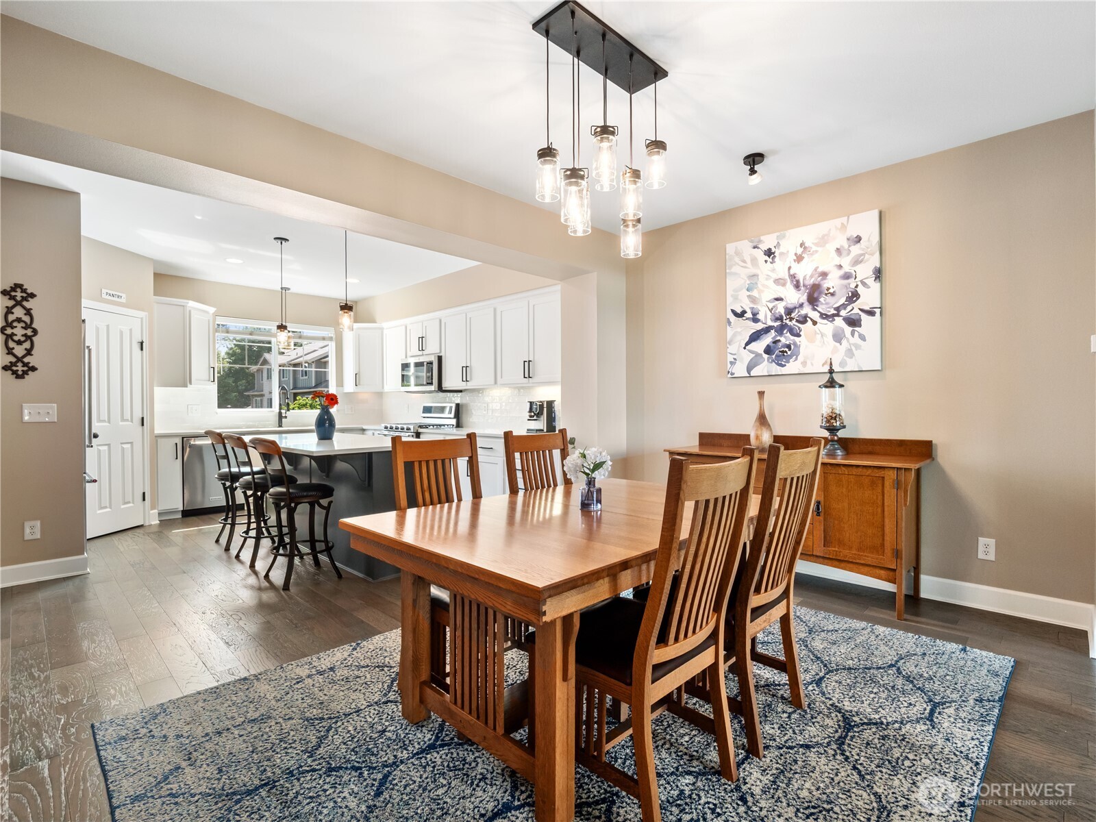 The heart of the home awaits in this spacious dining room, anchored by a beautiful craftsman-inspired dining set.