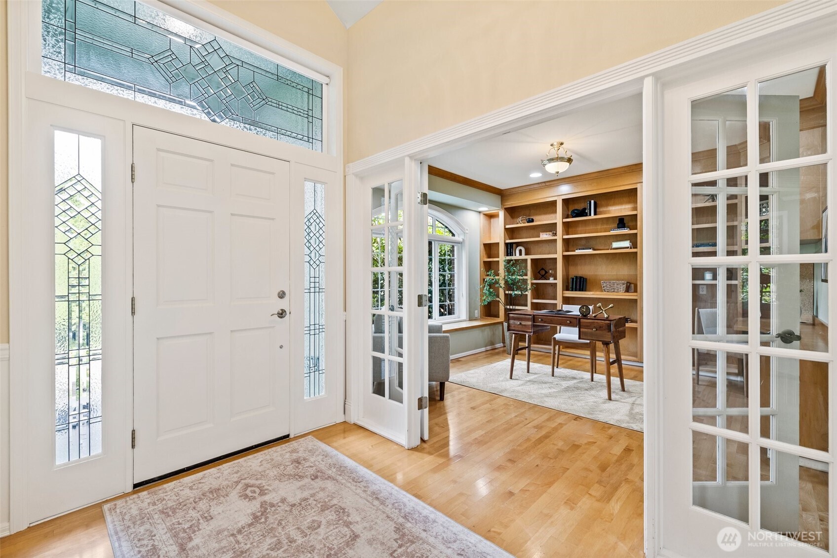 Entry foyer with office on the left and formal living room on the right.