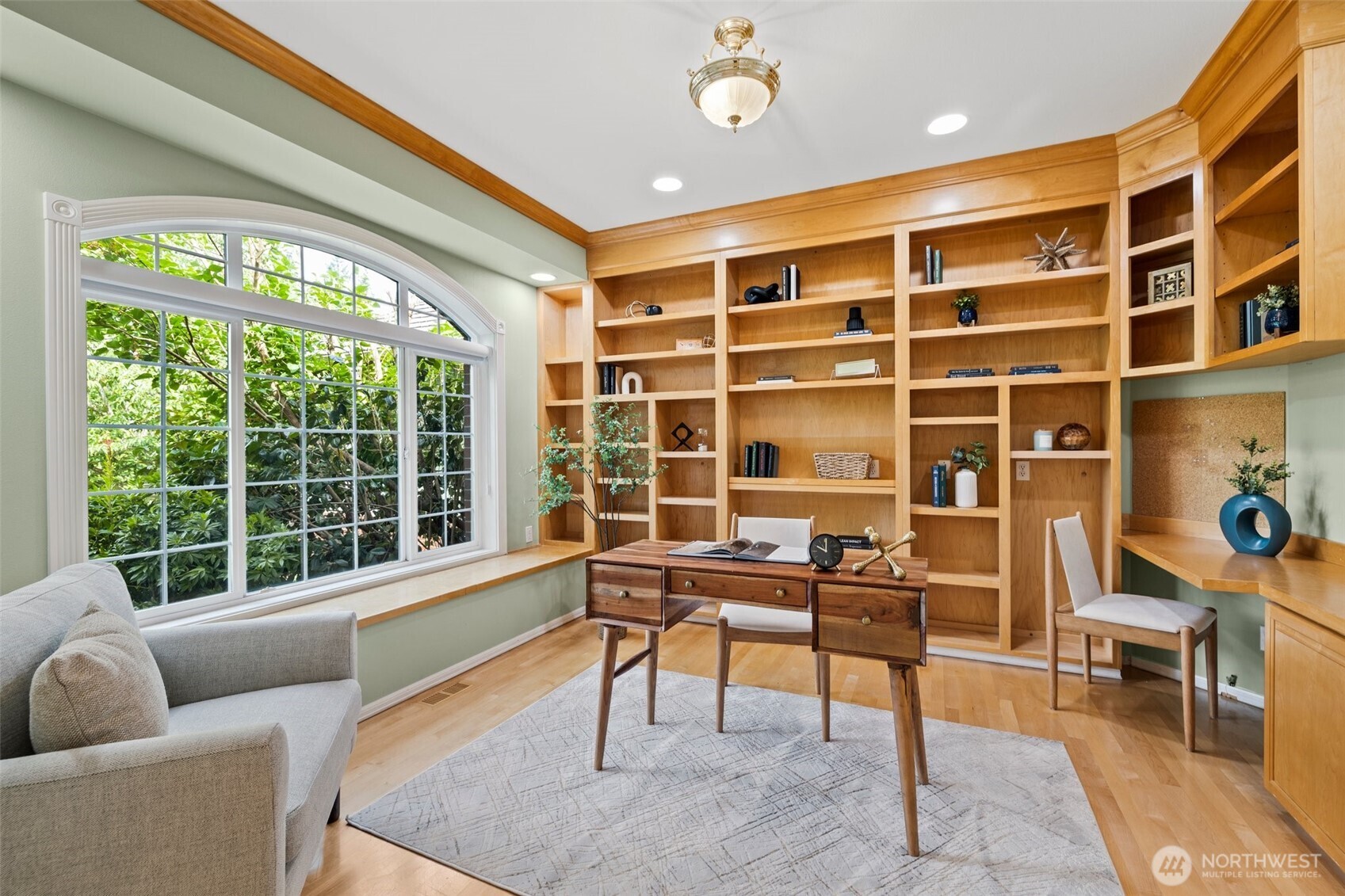 Here is the office with beautiful built-ins and hardwood floors.