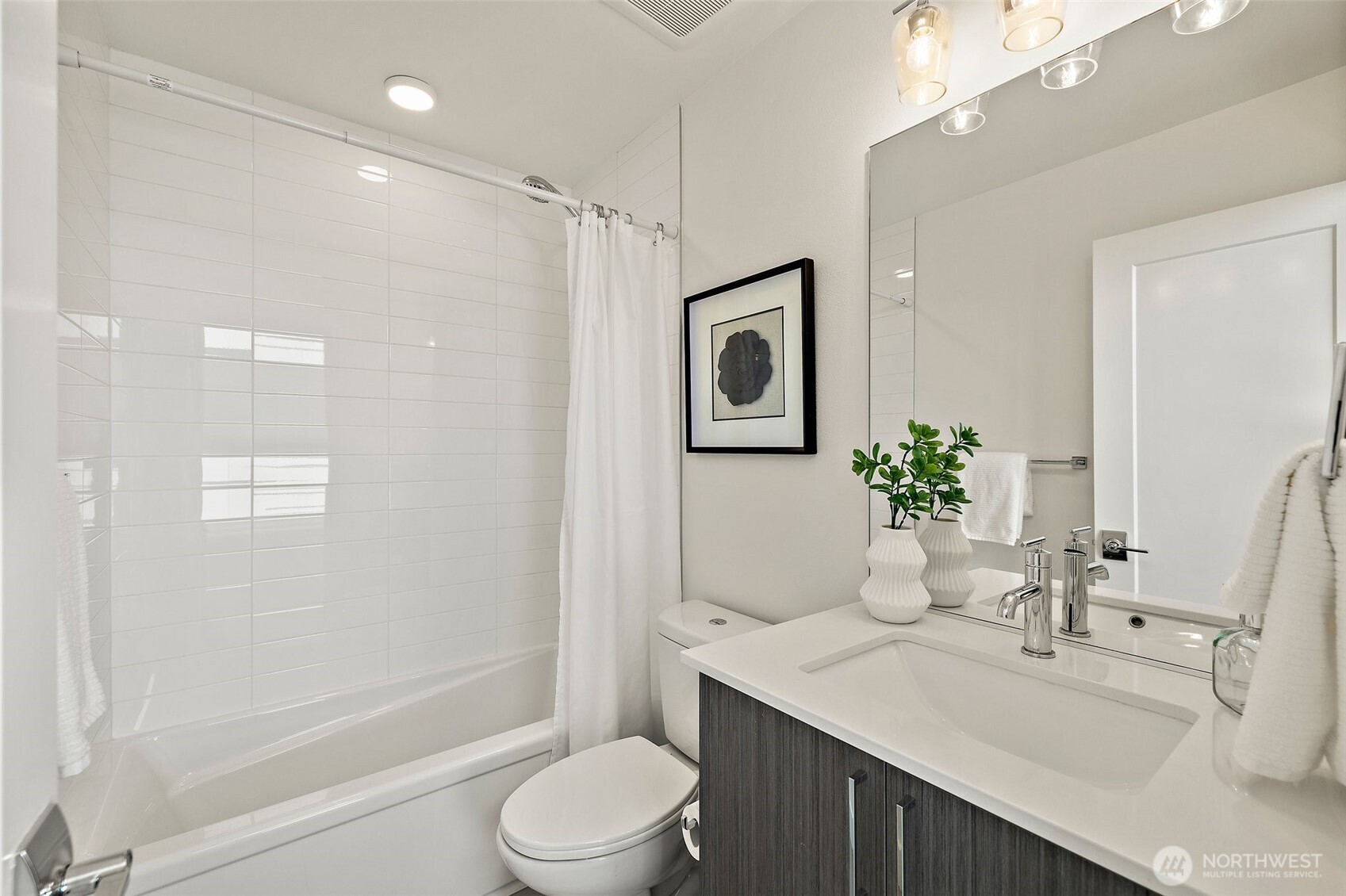 Full bath on level two between bedrooms 2 and 3. Pottery Barn perfect.