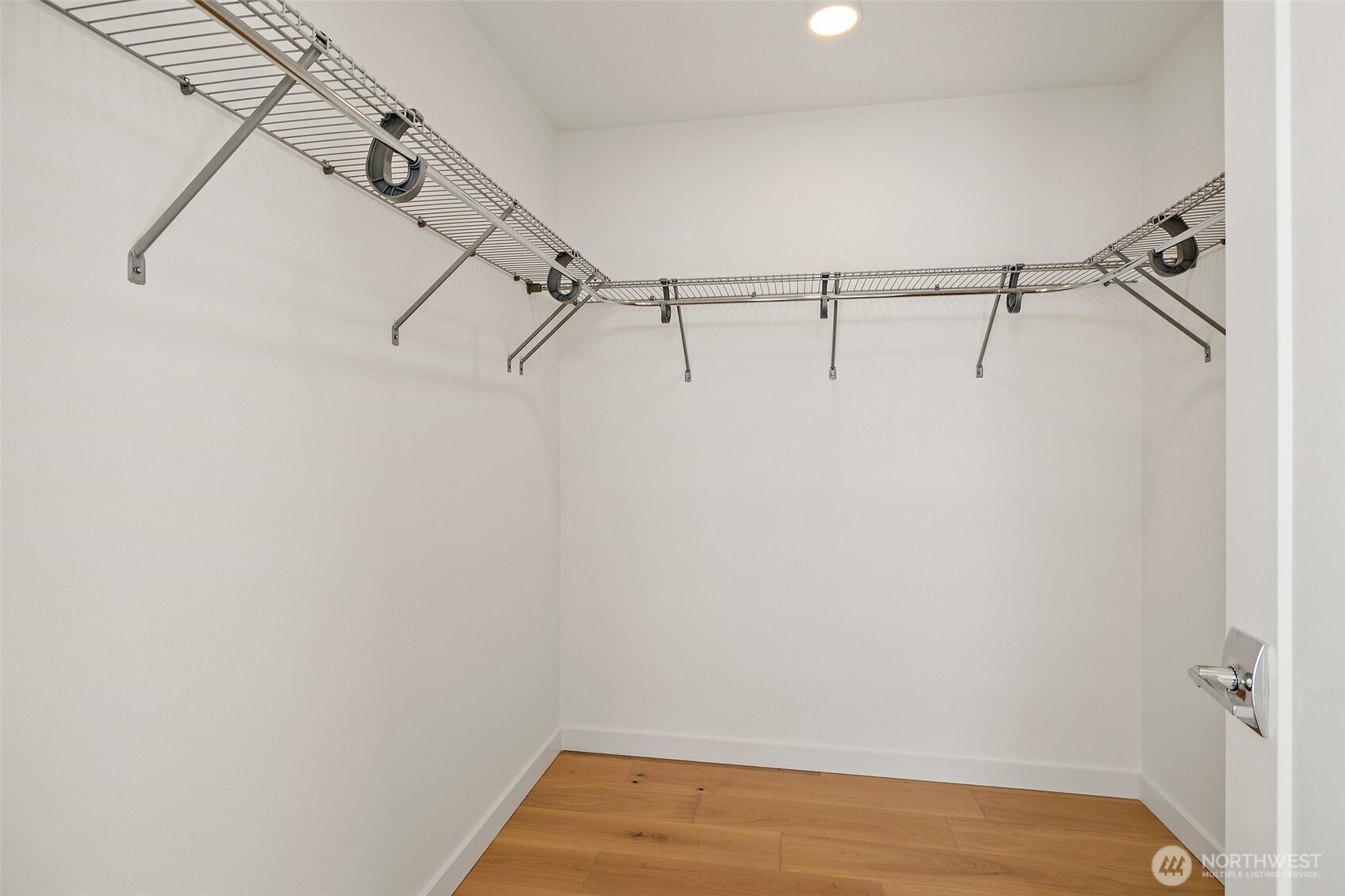 Primary bedroom walk-in closet.