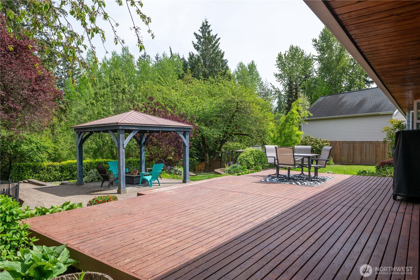 This property has it all, a grass yard, a pond, a deck a gazebo, an inground trampoline, it is fun for the whole family