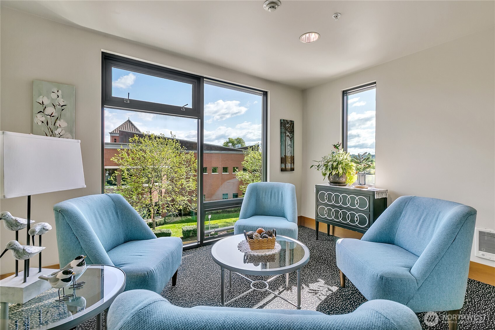 3rd floor gathering space with view of the library next door.