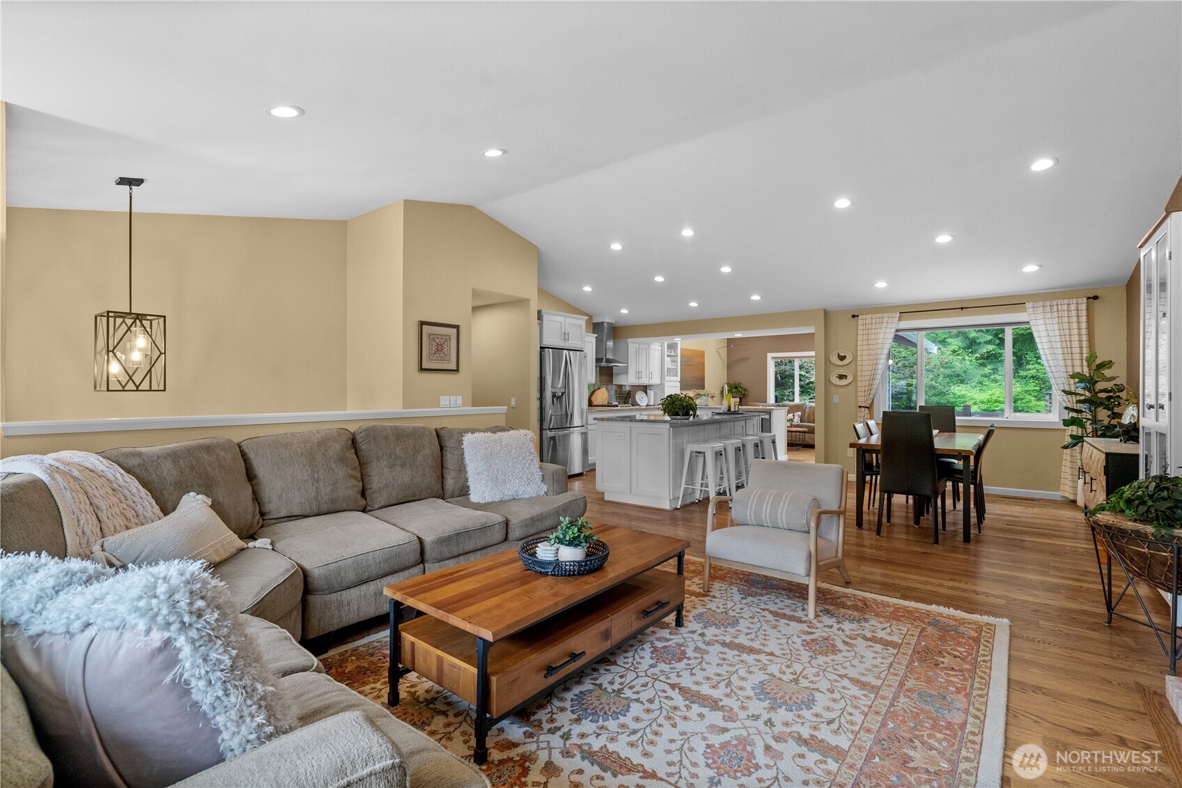 The vaulted ceiling enhances the room's sense of space, creating an open and expansive feel.