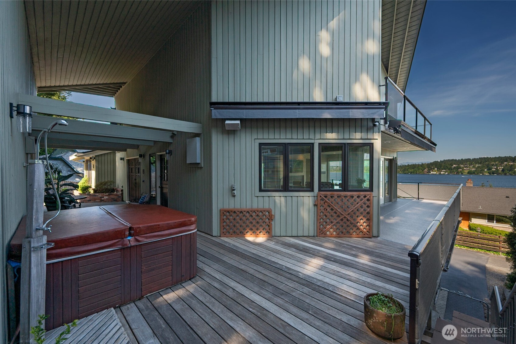 Two car garage / workshop plus additional guest parking by lower entrance. 158th Lane is a private road that accesses in or out onto 41st Avenue through a private gate.