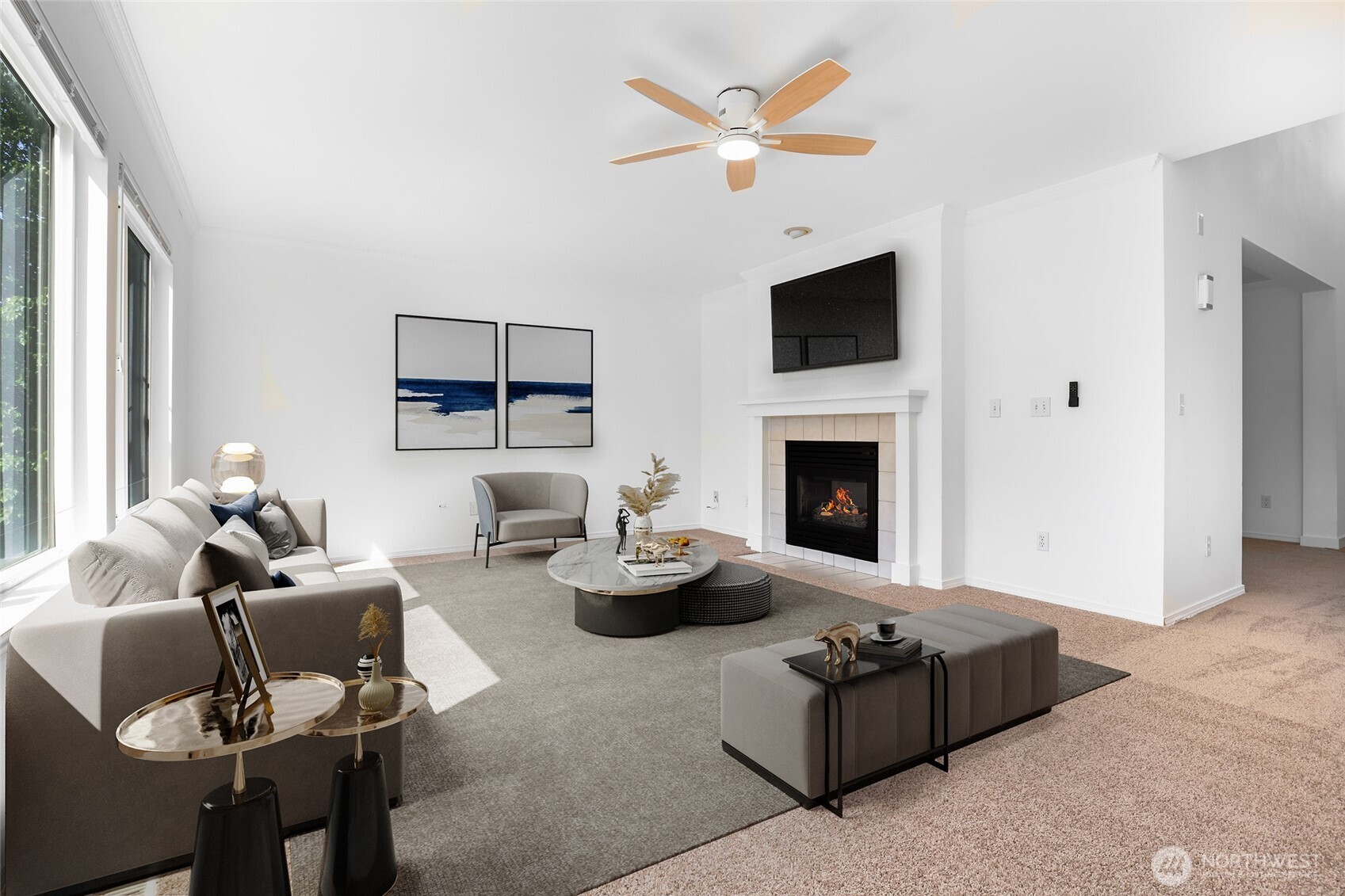 Virtually staged. Living room adjacent to kitchen with double-sided gas fireplace