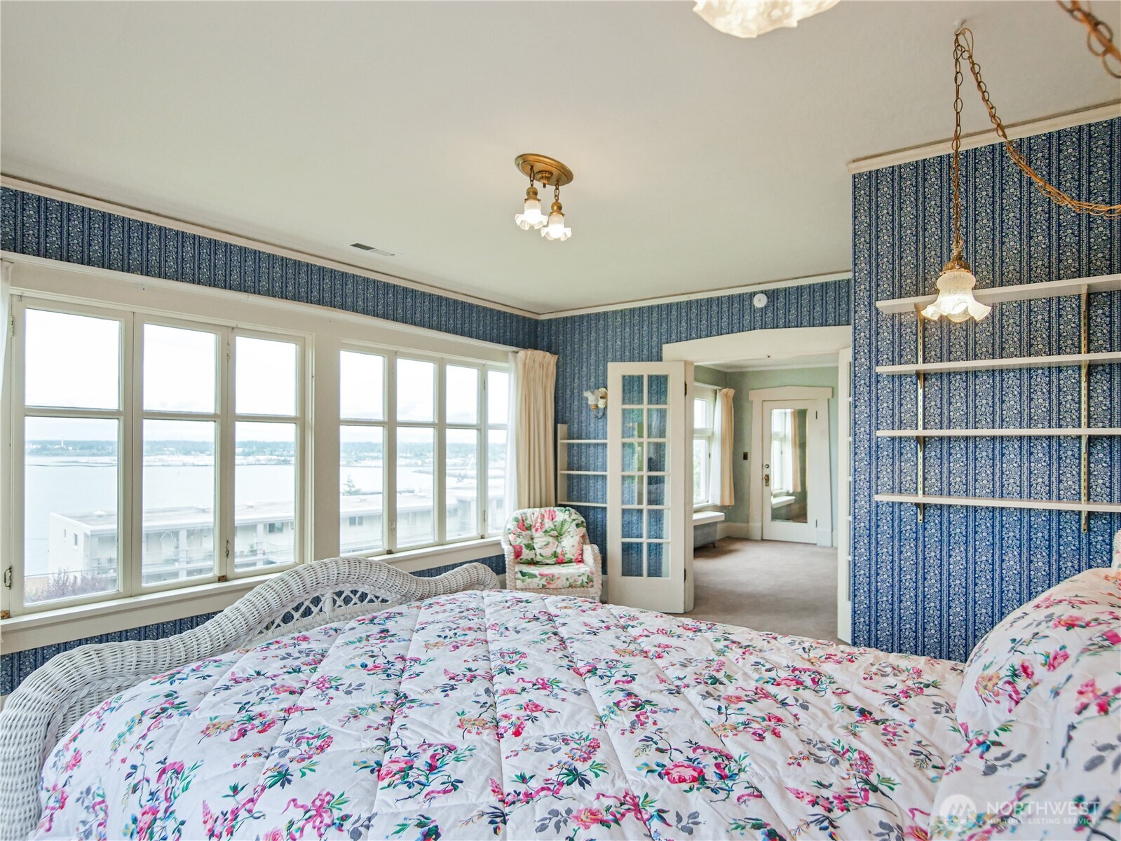 This is the primary bedroom with sweeping views of Bellingham Bay.