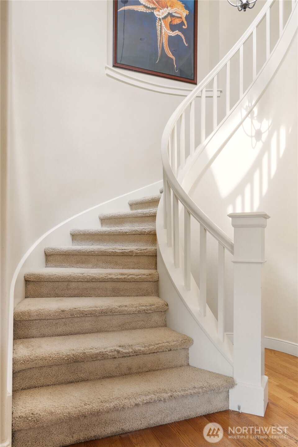 Stunning signature spiral staircase — a unique architectural feature that makes a grand statement.