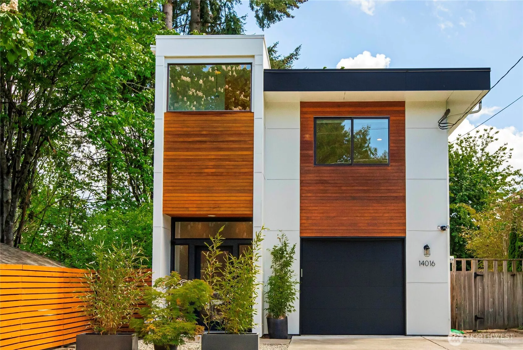 Welcome to a fabulous modern style 2 story home surrounded by trees located in Northeast Seattle.