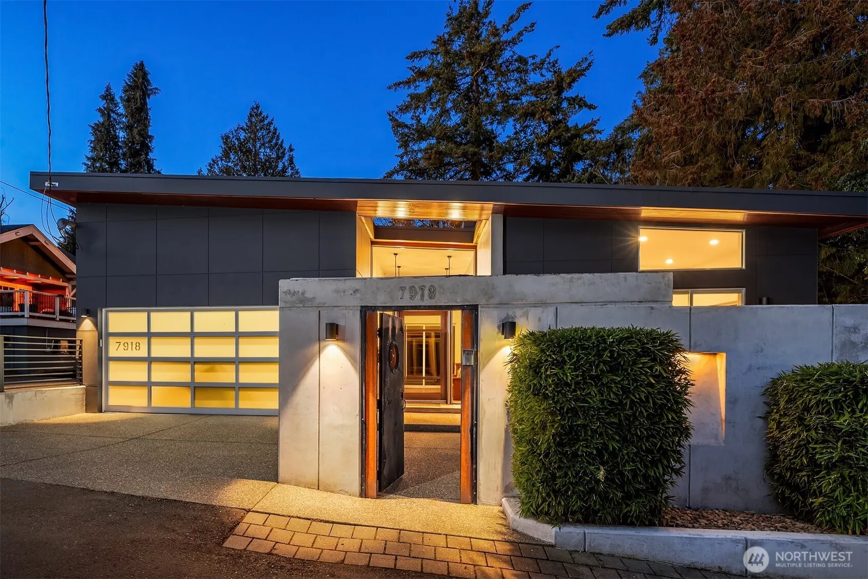 A Modern Boho Sanctuary in the Heart of the City! Step through the steel-framed gate with salvaged ship porthole, and you're immediately transported into a hidden courtyard, a secret oasis where lush greenery and architectural elements set the tone for the home’s serene ambiance.