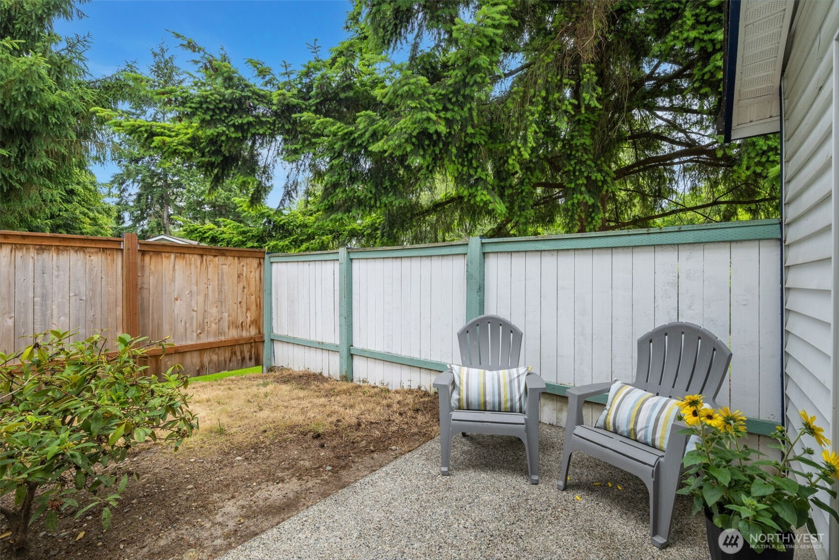 Private patio outside main floor bedroom. Lovely verdant surroundings!