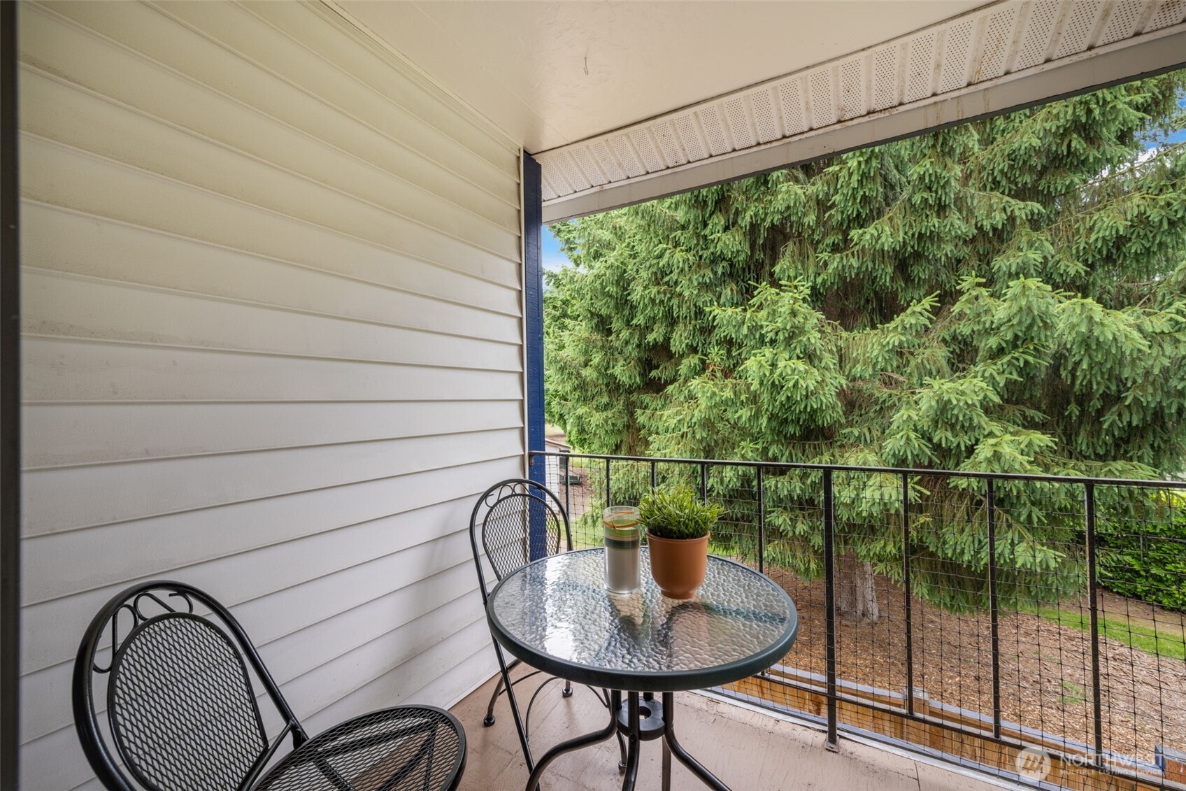 Private and covered balcony deck off upper primary bedroom