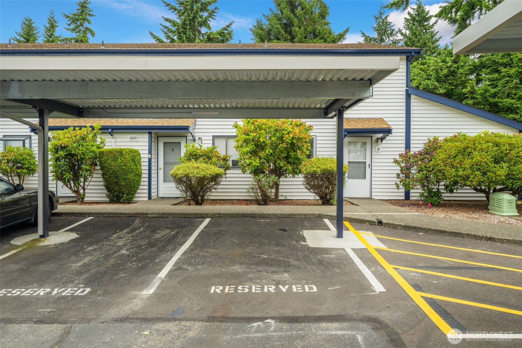 Two dedicated + covered parking spaces in front of your unit - no pesky stairs!