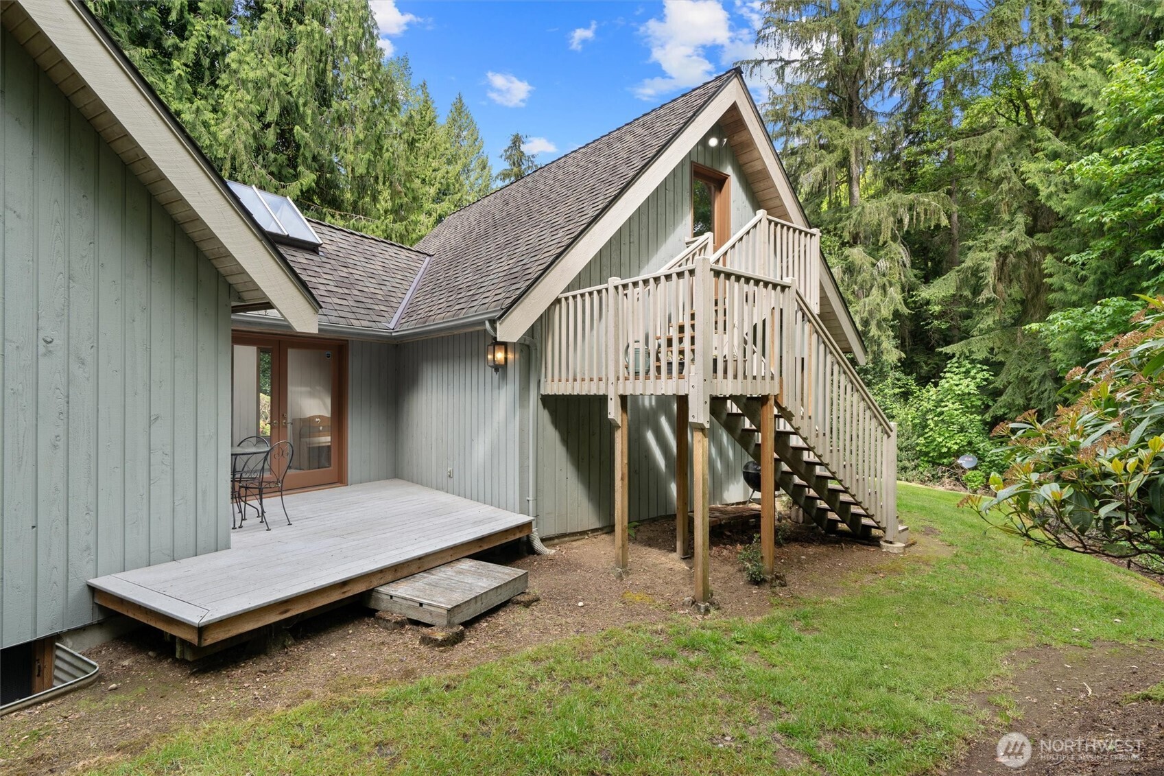 Additional deck and stairs that lead up to the bonus room above the attached garage