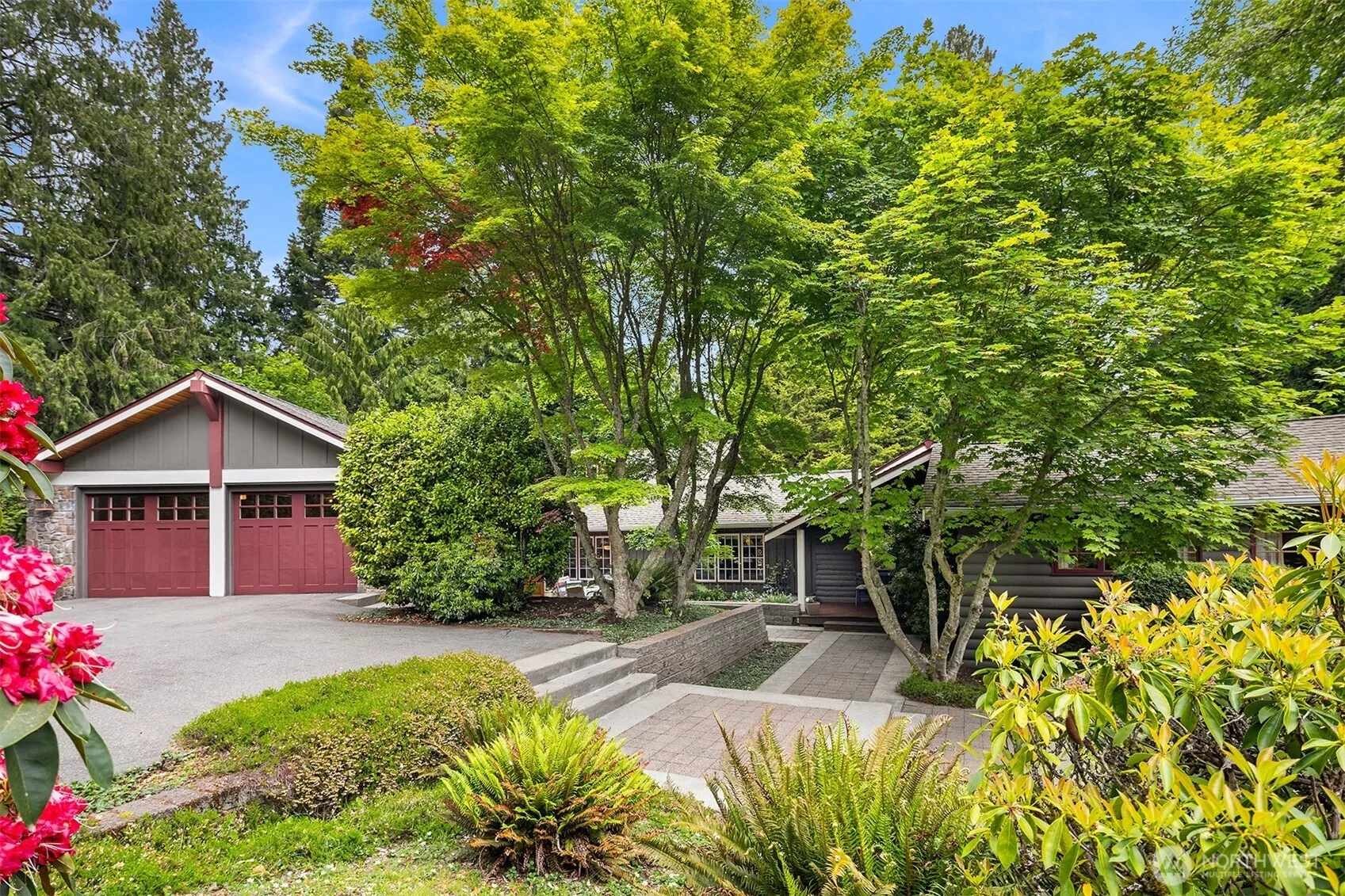 Welcome to this inviting home via a large, South-facing patio dappled with sunlight!