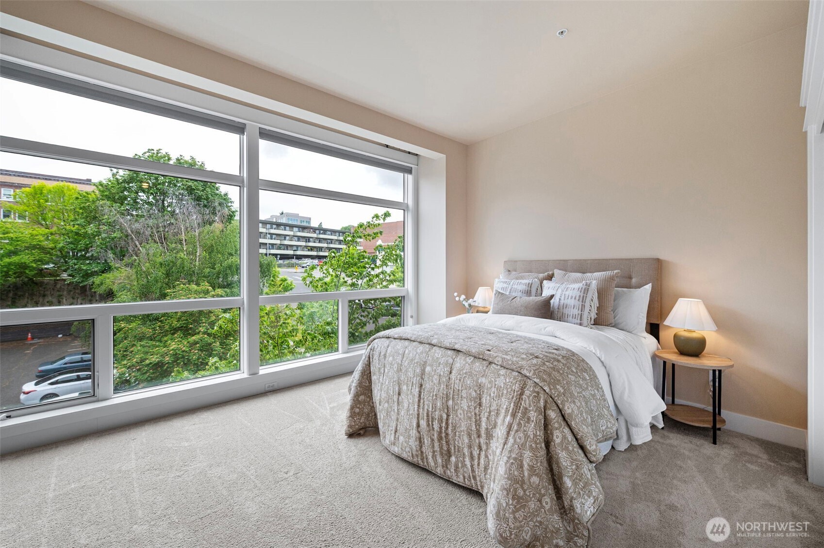 Large Primary bedroom on 2nd floor with wall of windows & room for sitting area.