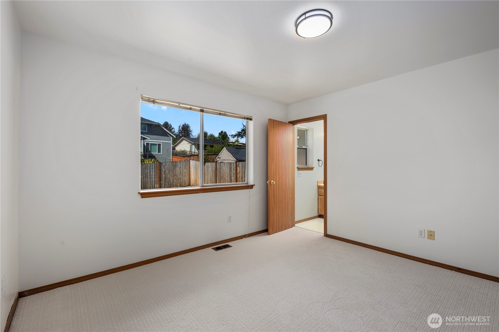 Another view of primary bedroom