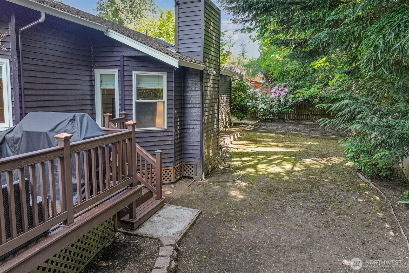 The fully fenced backyard features dappled shade, mature landscaping, and a blank canvas ready for lawn, play, or gardens. Enjoy privacy and room to personalize in this peaceful outdoor retreat.