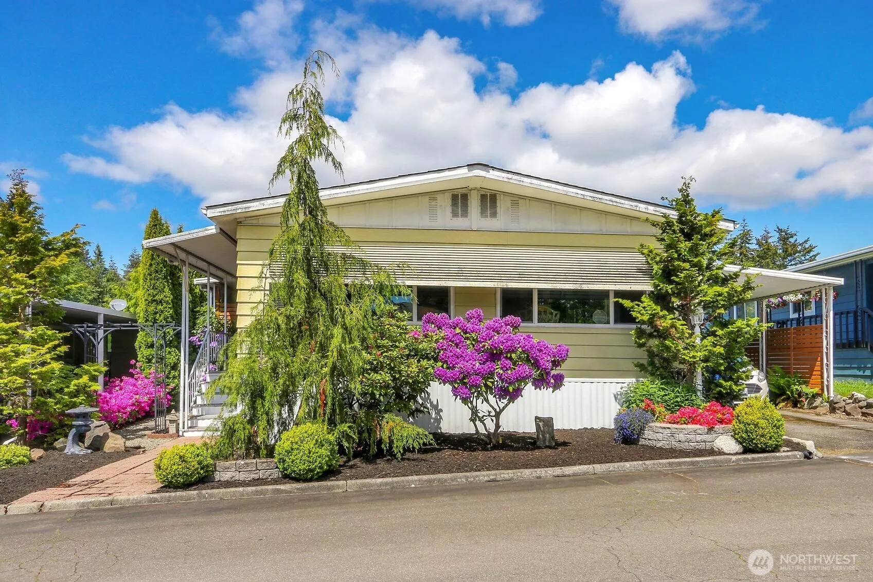 Nicely updated double wide with newer roof, windows, wood flooring, updated kitchen and A/C!