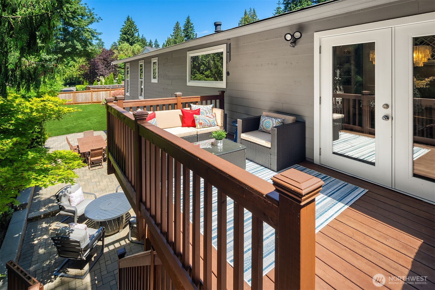 Main floor deck with stairs to the patio