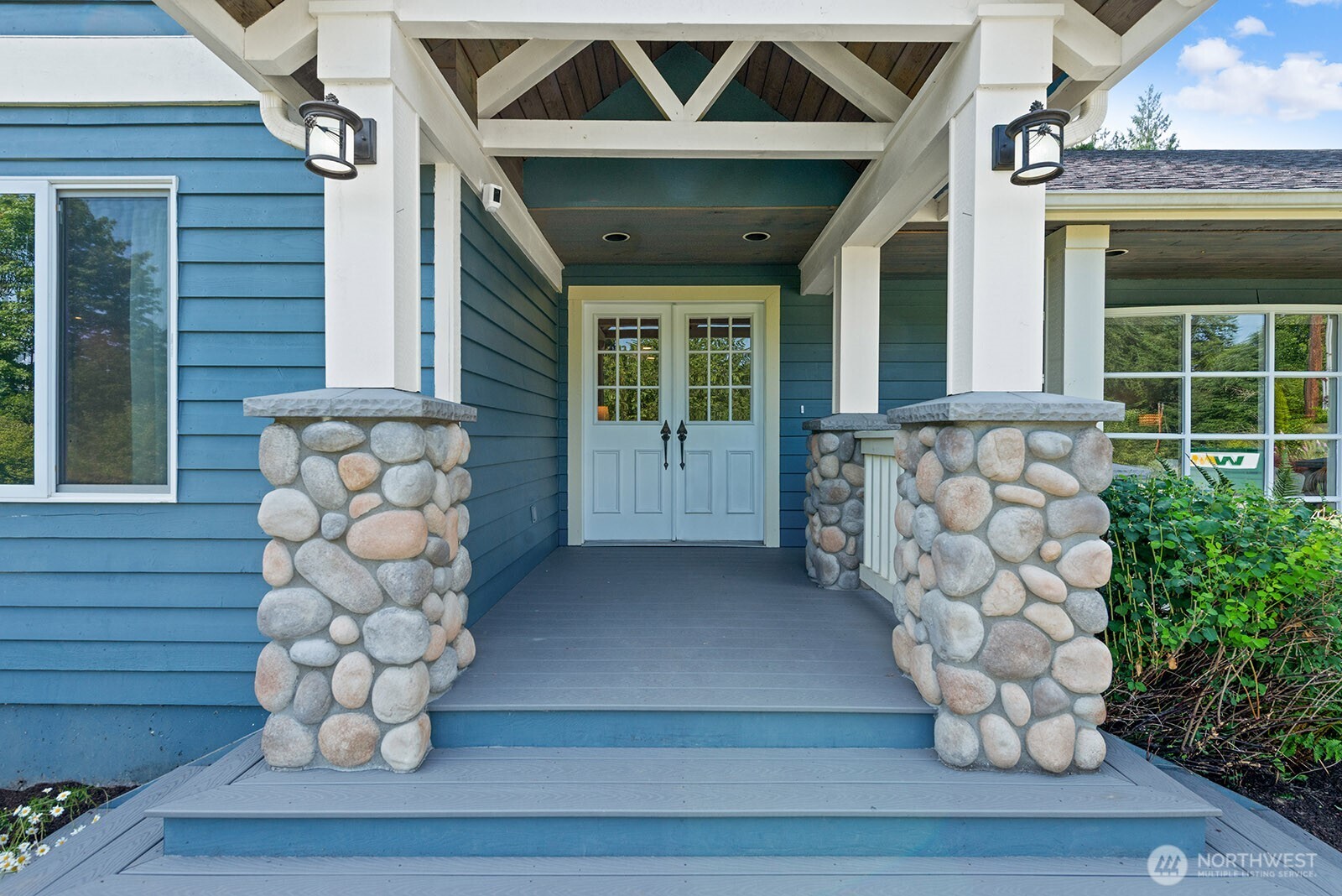Stunning entry with covered porch.