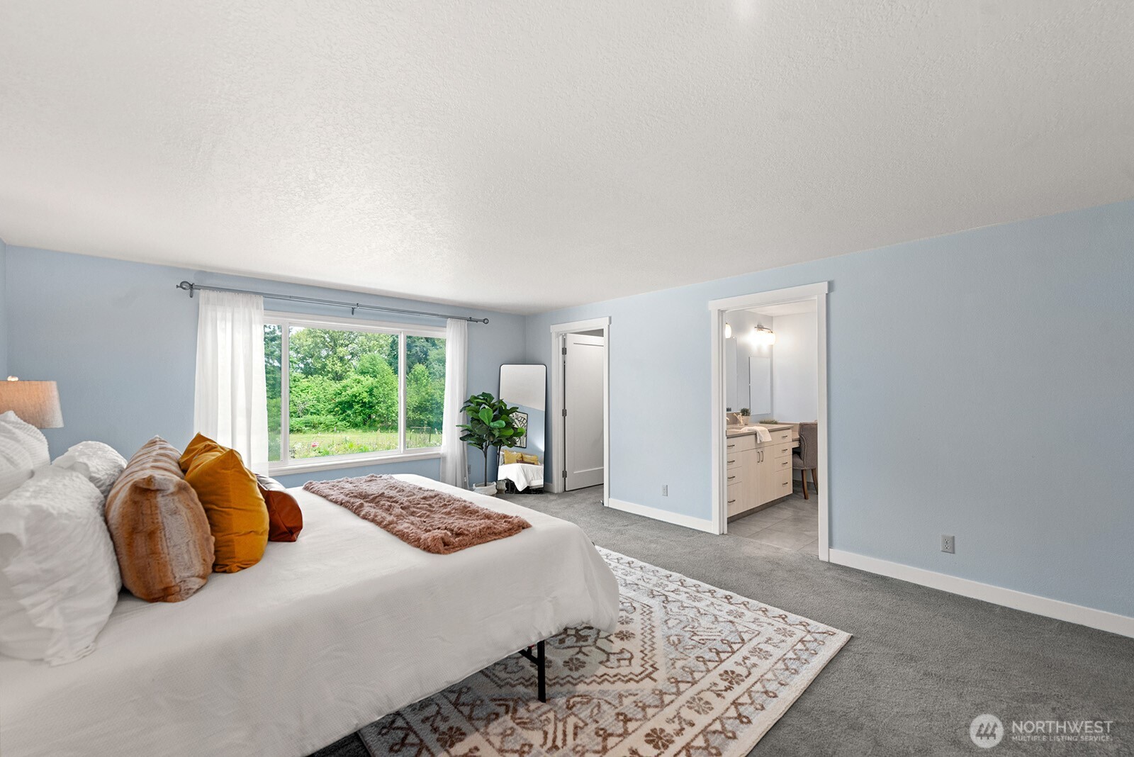 Large primary suite with walkin closet and udated bathroom.