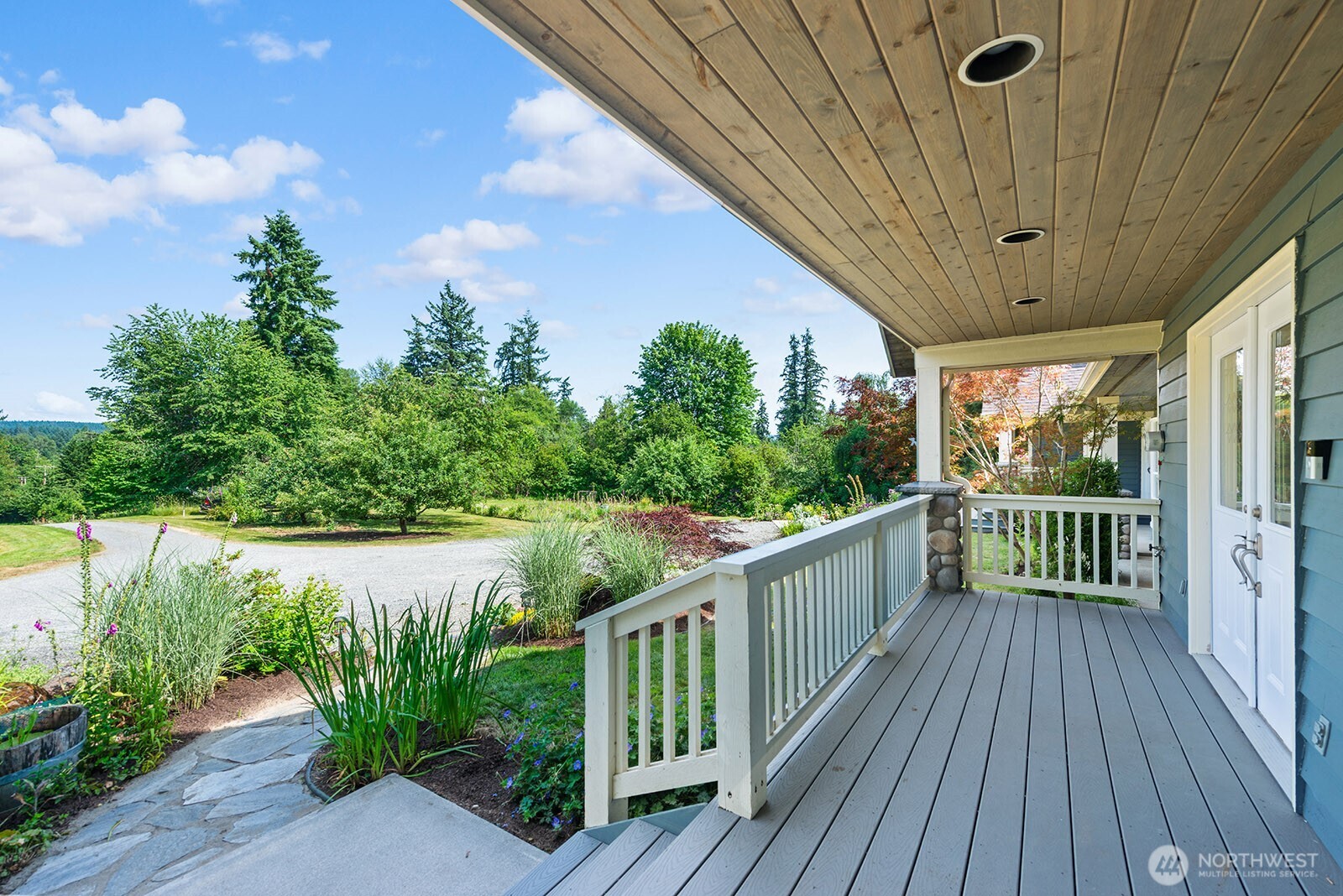 Beautiful front porch with French doors to the bonus room.