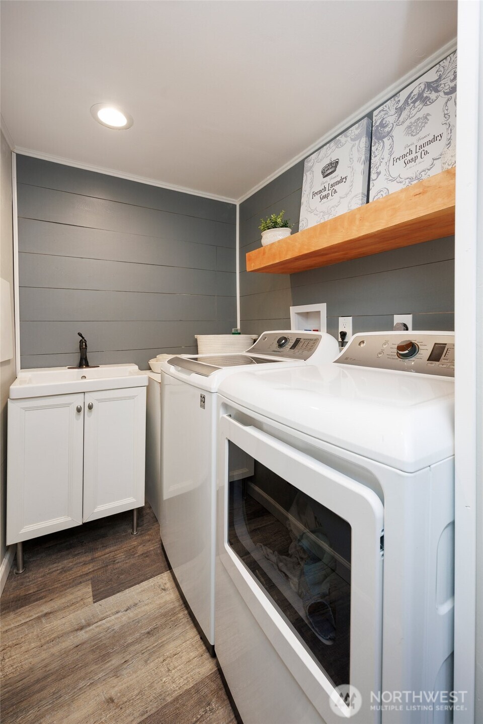 Remodeled lower level laundry room. All appliances stay.