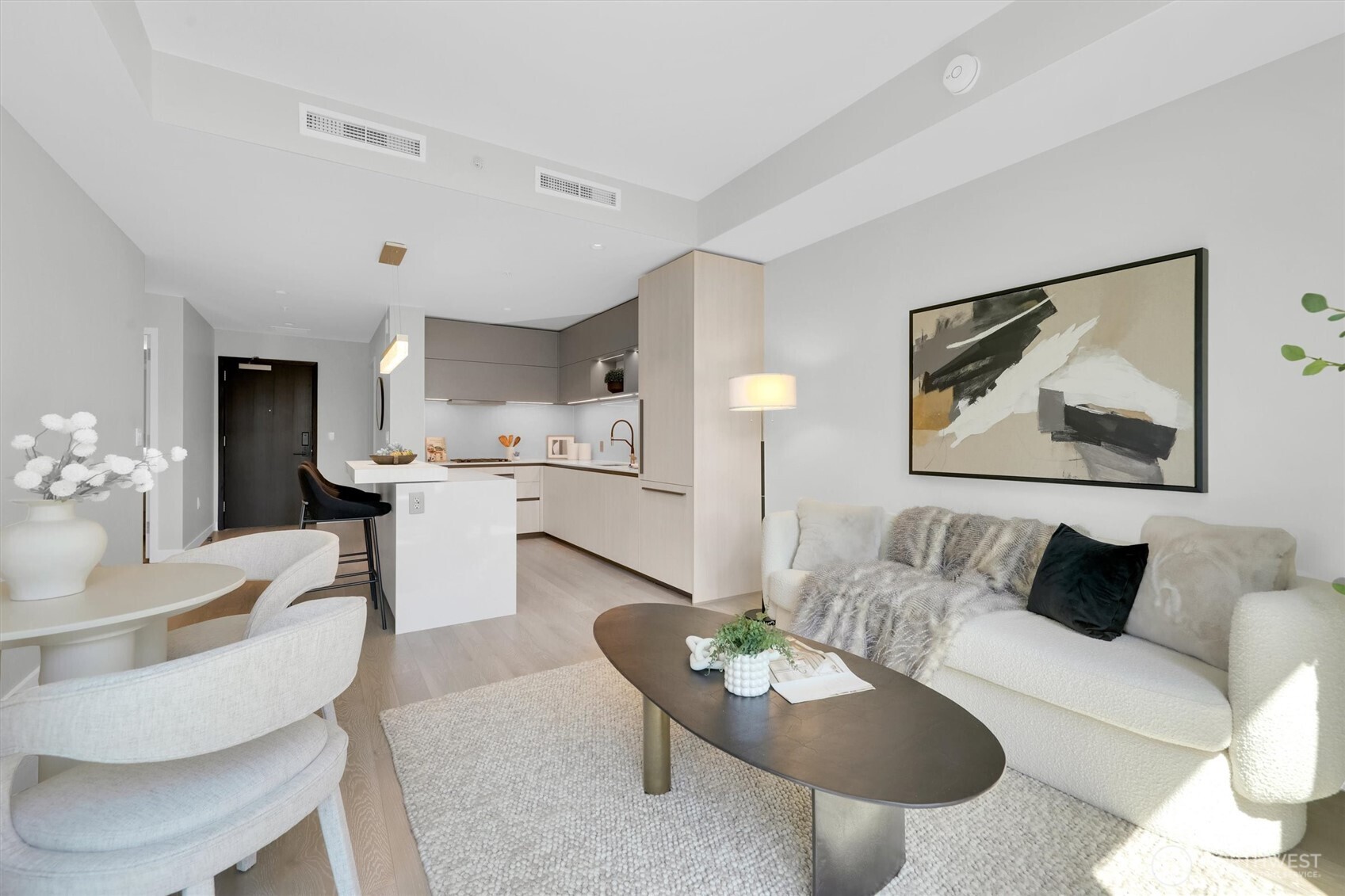 Modern living room and kitchen equipped with upscale kitchen appliances
