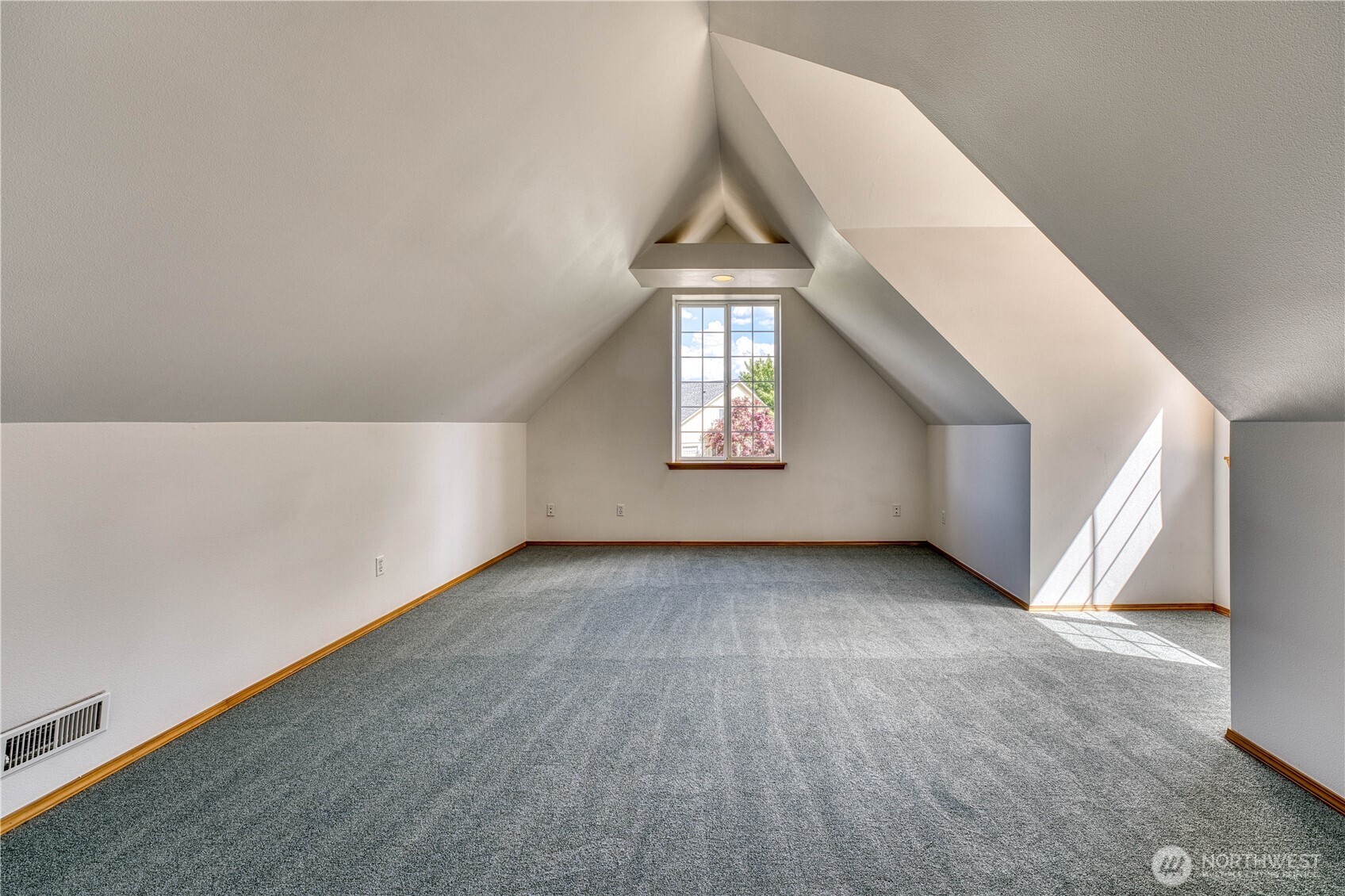 Large bonus room over the garage has endless uses.