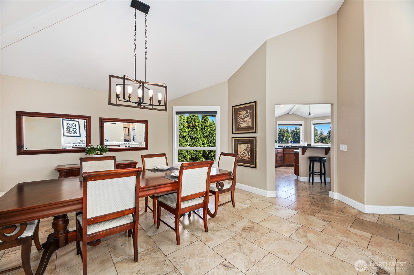 Spacious primary bedroom suite with electric fireplace and captivating views.