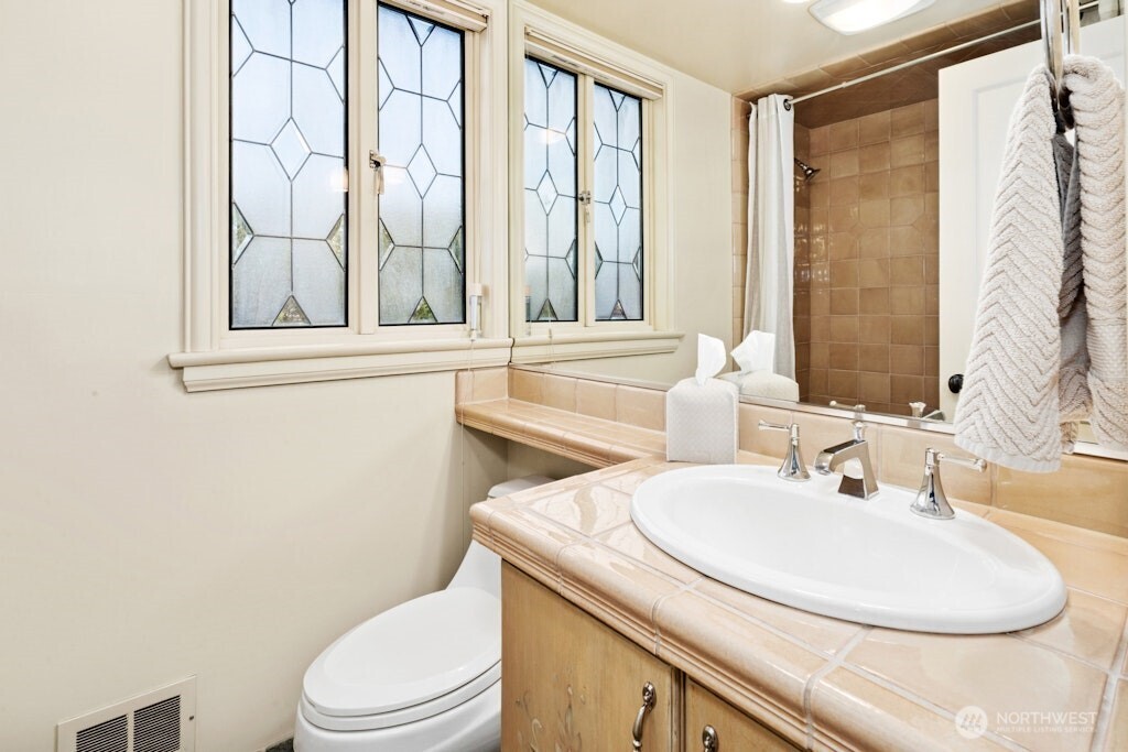 The upper floor boasts three spacious bedrooms, all with window seats to relax and soak in the views.