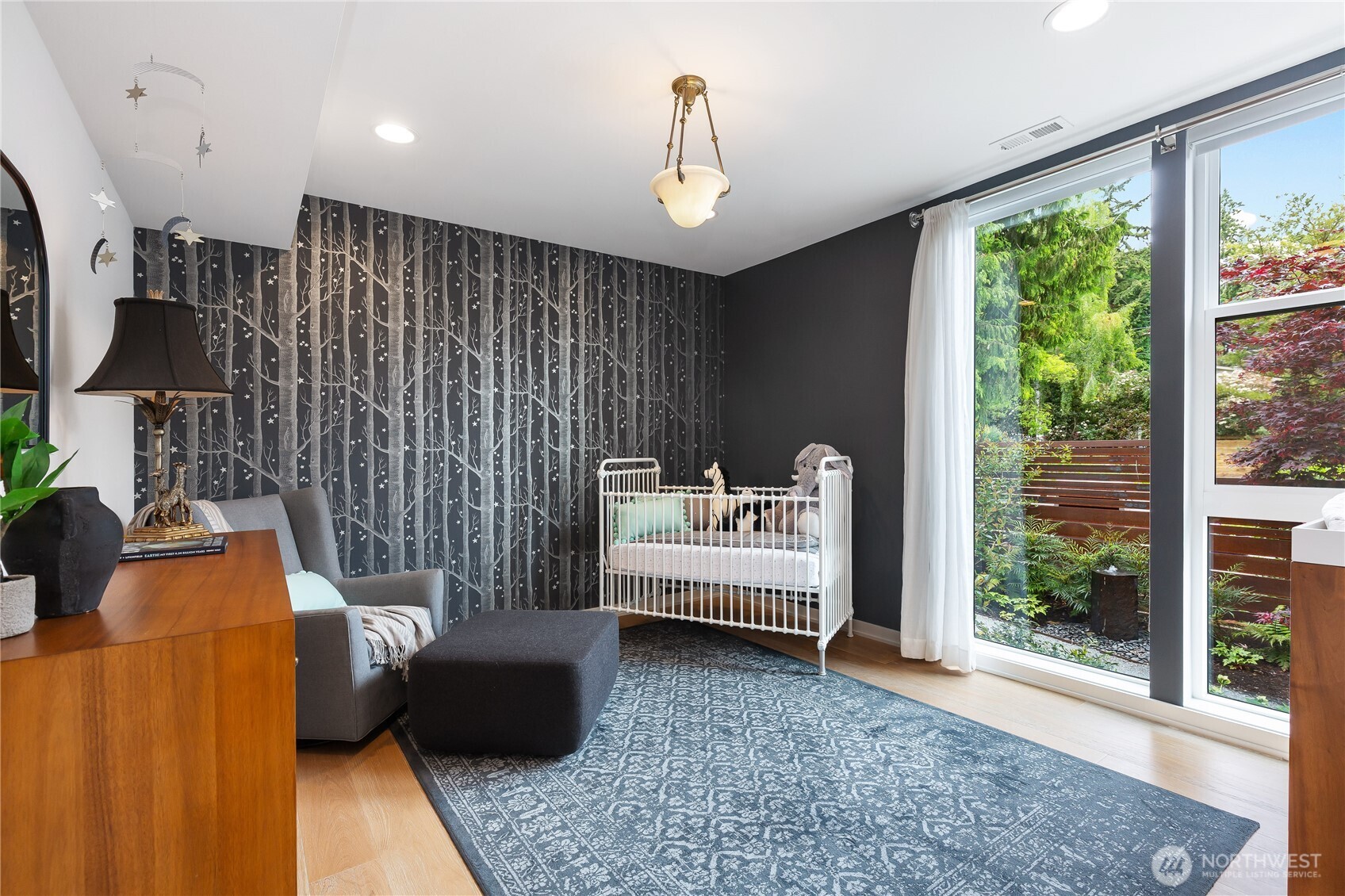 One of four large bedrooms, large walk-in closet, exceptional light with a treed outlook.