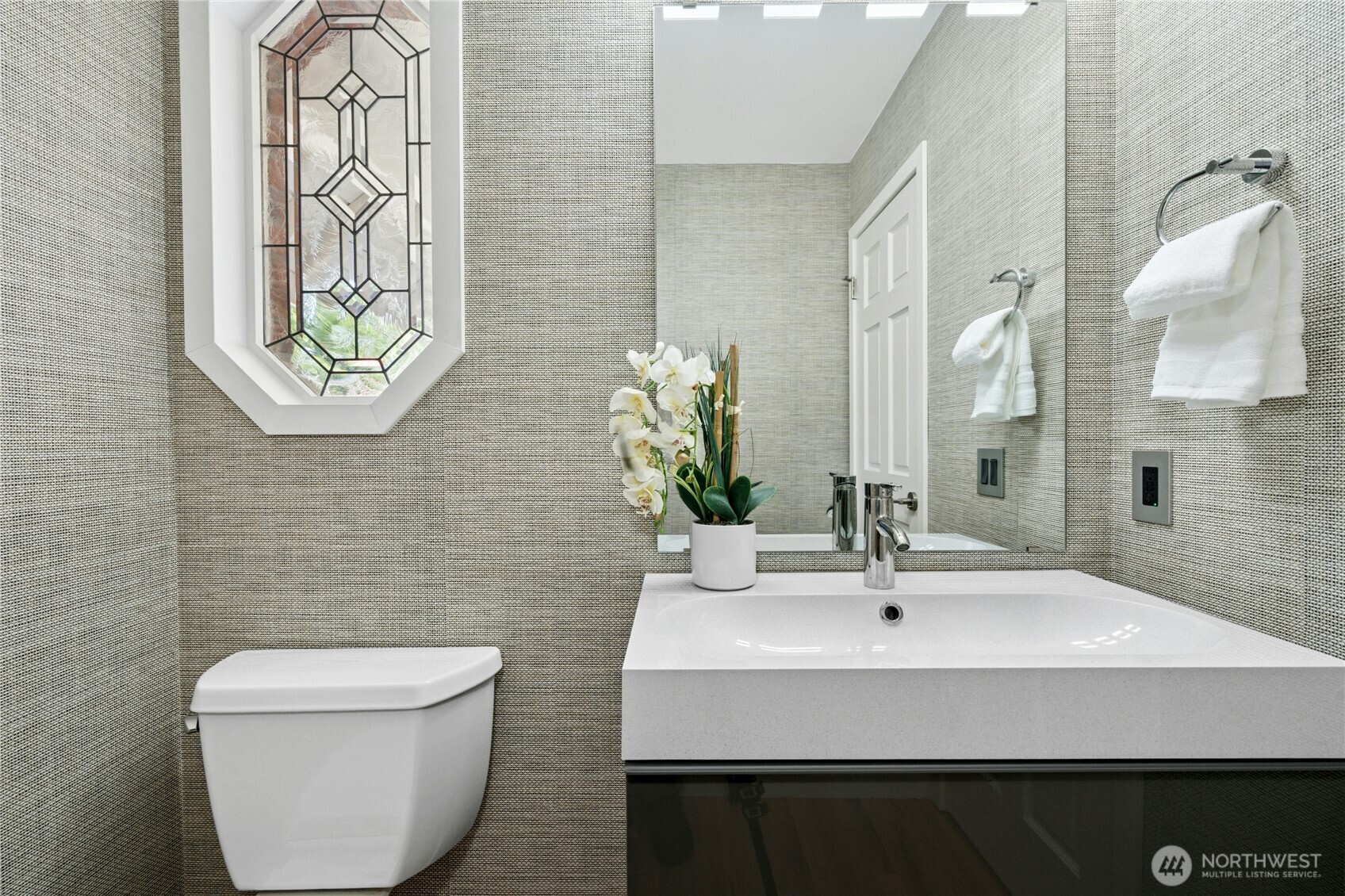 Modern guest bath on main level.