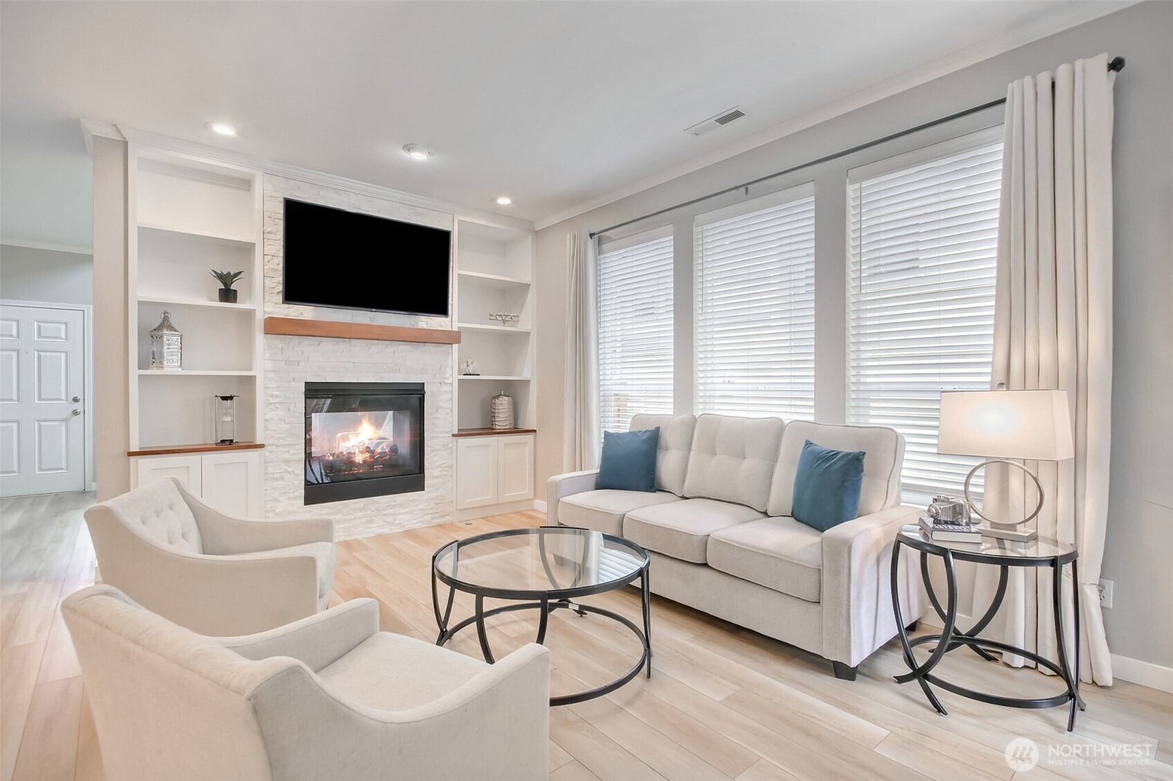 Great family room with updated gas fireplace w/ stone surround & built-in bookcases. Newer luxury vinyl plank flooring through out the house. This home also features central air conditioning