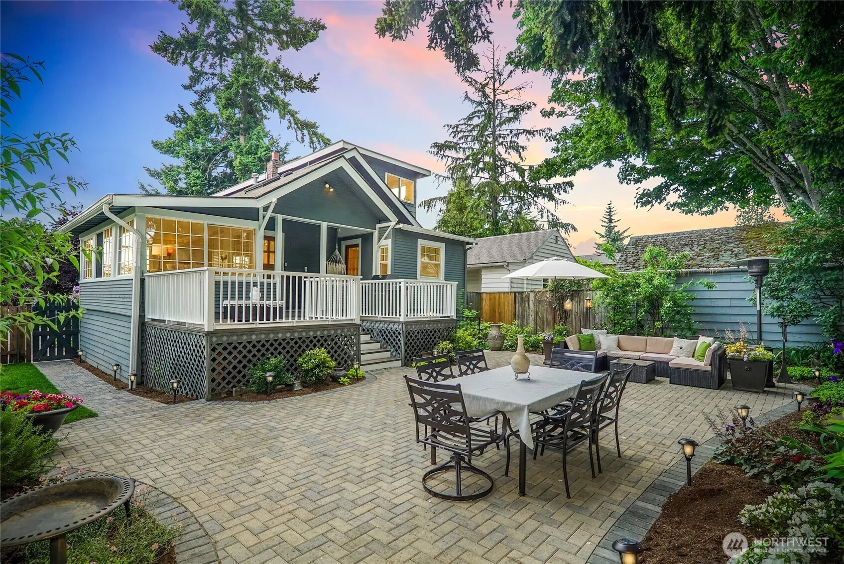 Welcome to this beautifully maintained craftsman with a magical back garden that is graced by gorgeous herringbone pavers. Perfect for summer gatherings!