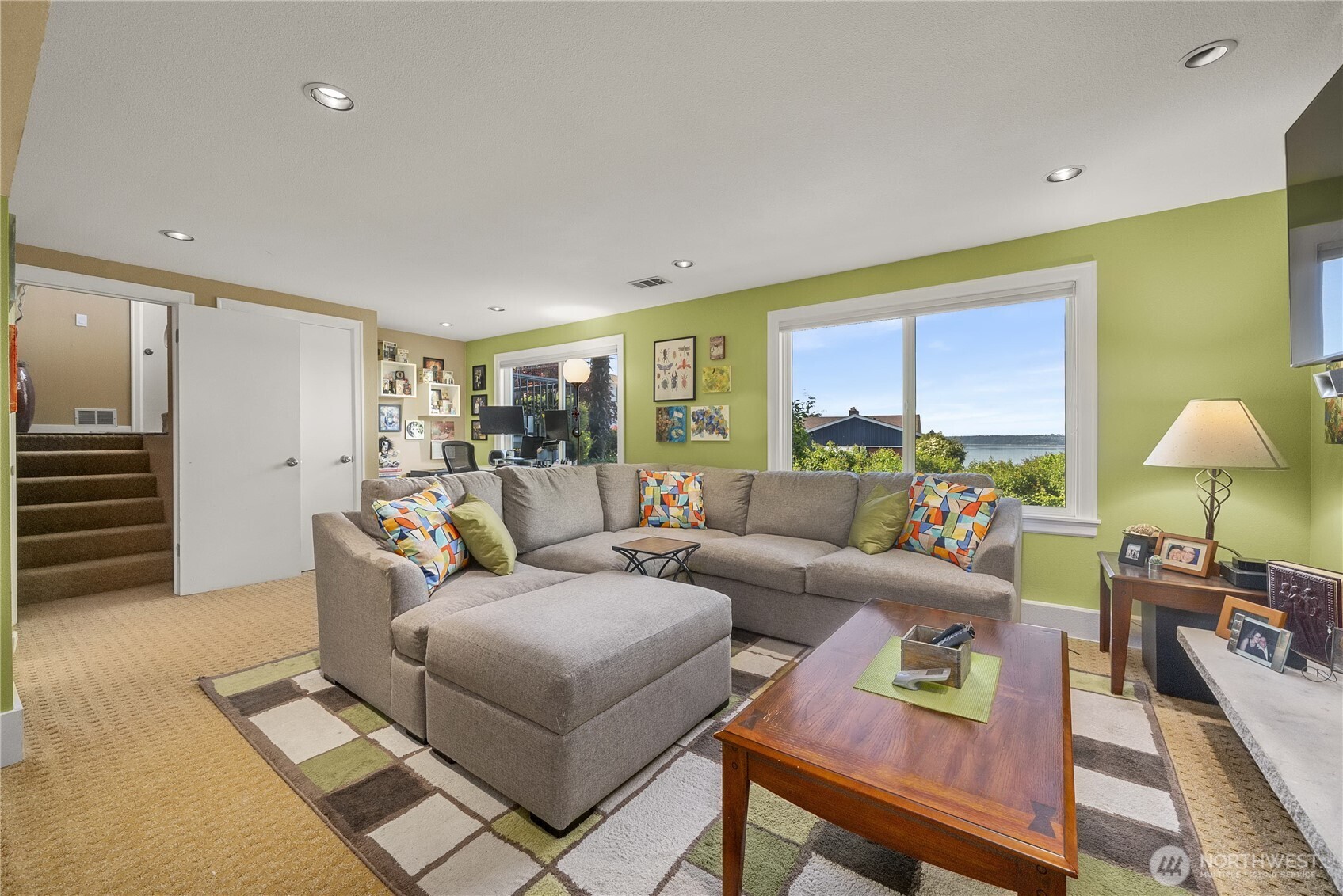 A additional view of the Family Room showing the View and the 2nd Gas-Log Fireplace. Notice the Recessed Lighting and Classic Brick Fireplace Surround providing a timeless aesthetic; it’s warm, cozy and comfortable.