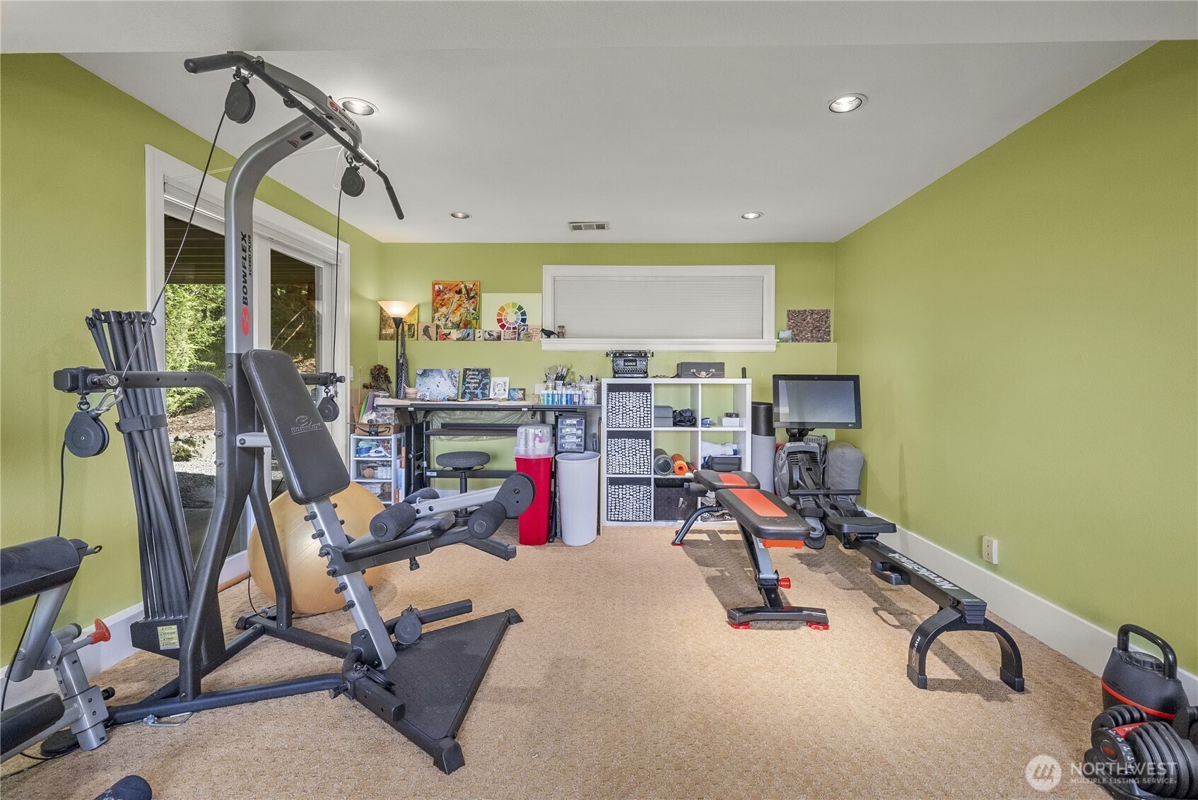 To the right of this photo is another area of the Family room, currently being used as a Multipurpose Art and Exercise area. This Family Room is a truly a Multi-functional, Versatile Space.