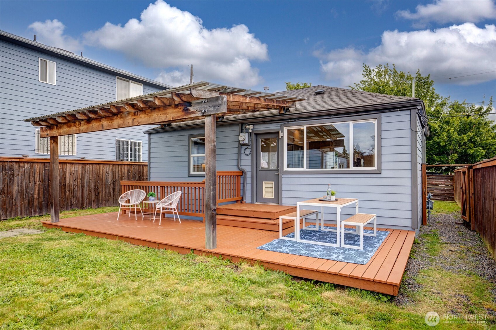 Covered back porch - great for entertaining year round!