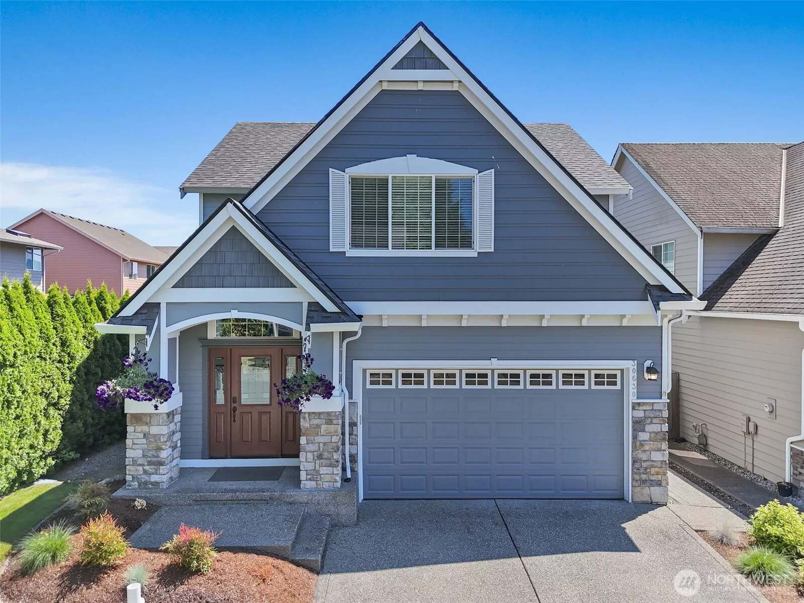 Recent roof, exterior paint, mature landscaping, sprinkler system.