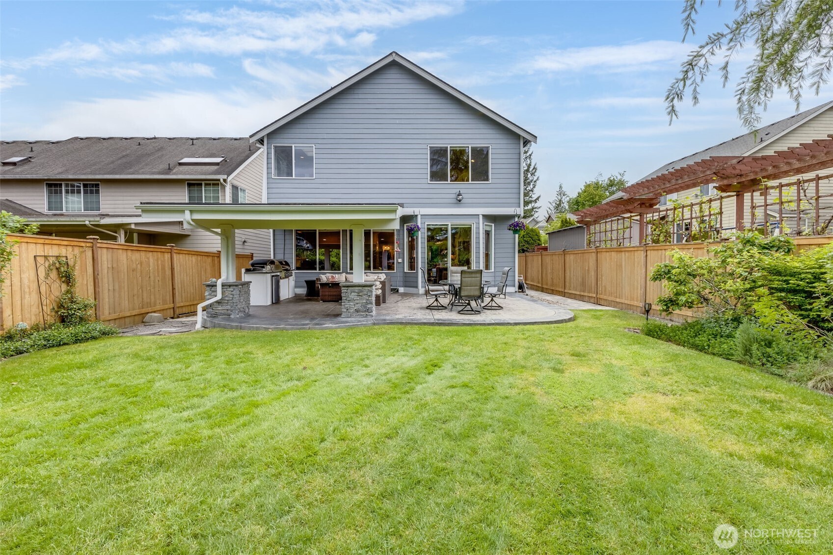 Large yard, nice and mature landscaping. Sprinkler system.