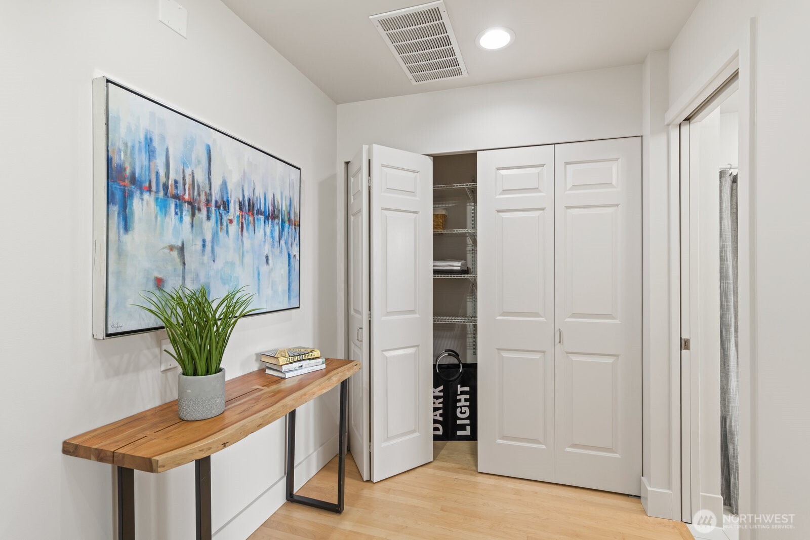At the top of the stairs, this alcove is a perfect nook for your desk, a cozy nook for your favorite chair, laundry area folding space, or bookshelves!