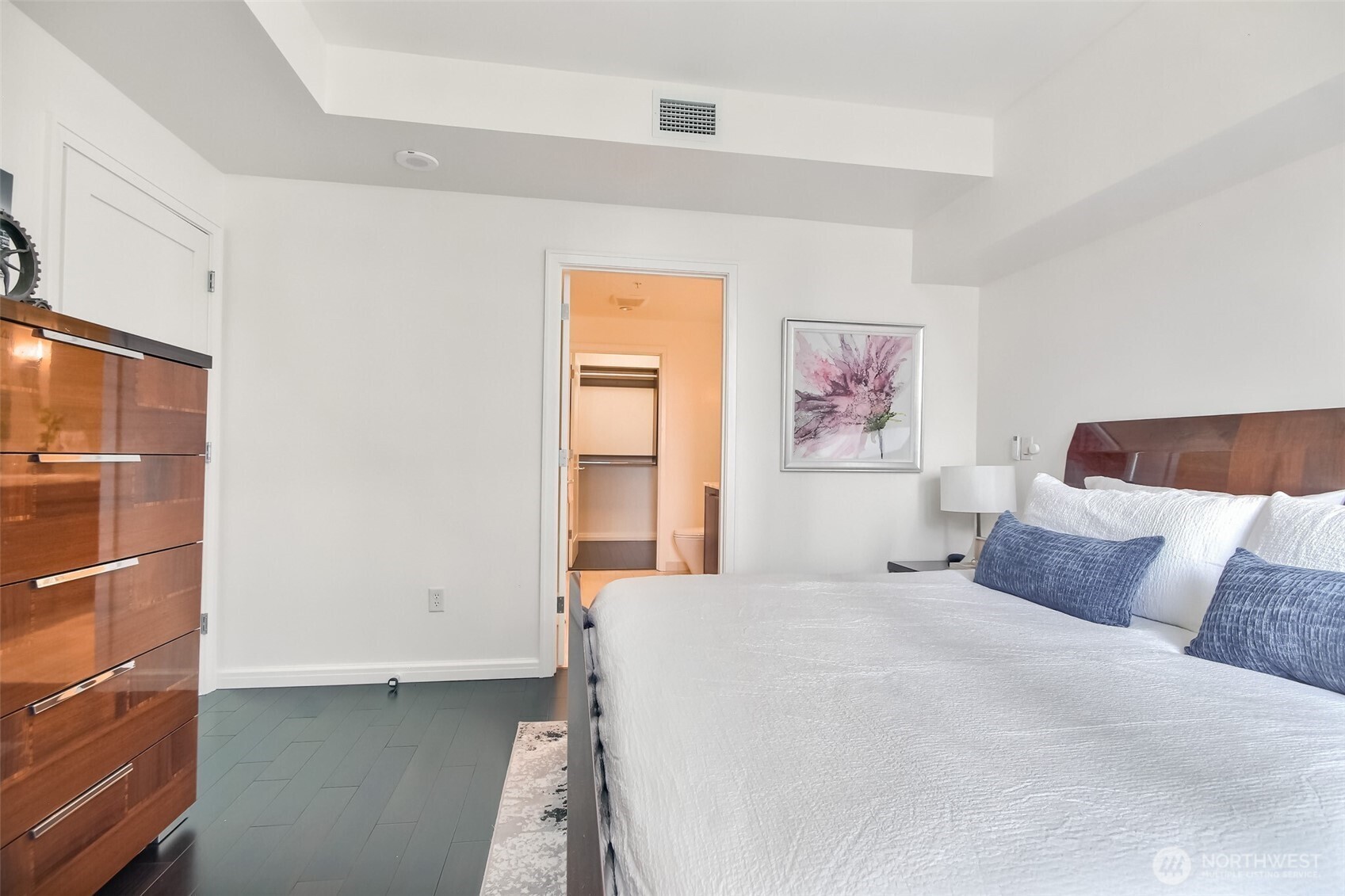 Primary bedroom with hardwood floors