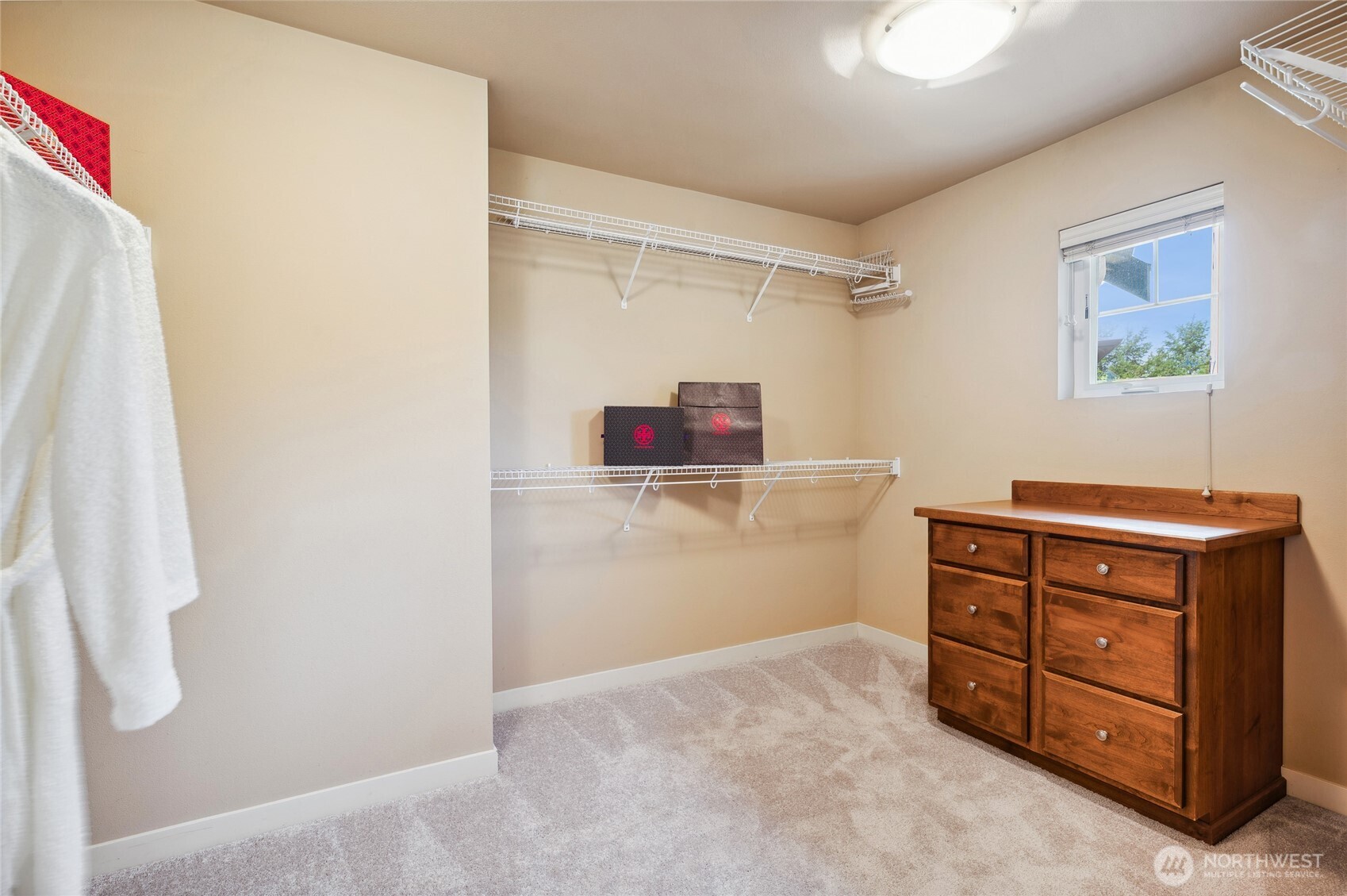Upper level bathroom with a dual vanity, tub & shower.