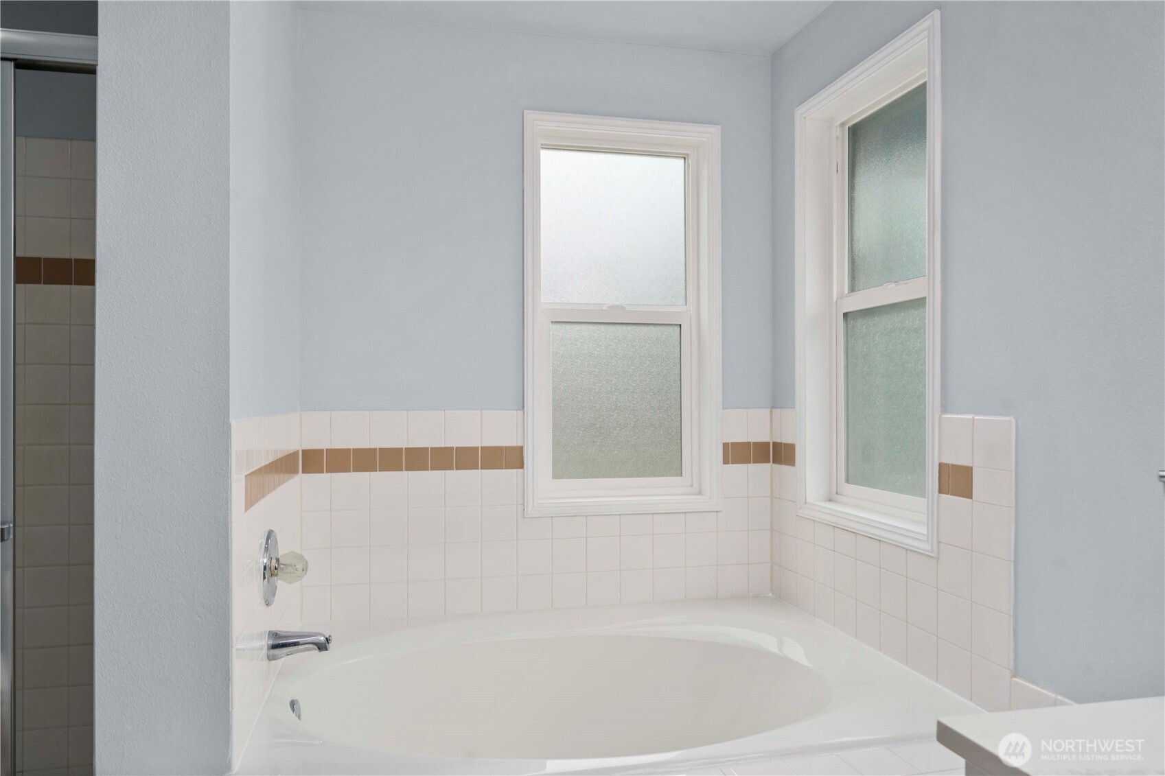 Privacy glass lets in the light for those quiet moments when you treat yourself to the soaking tub.