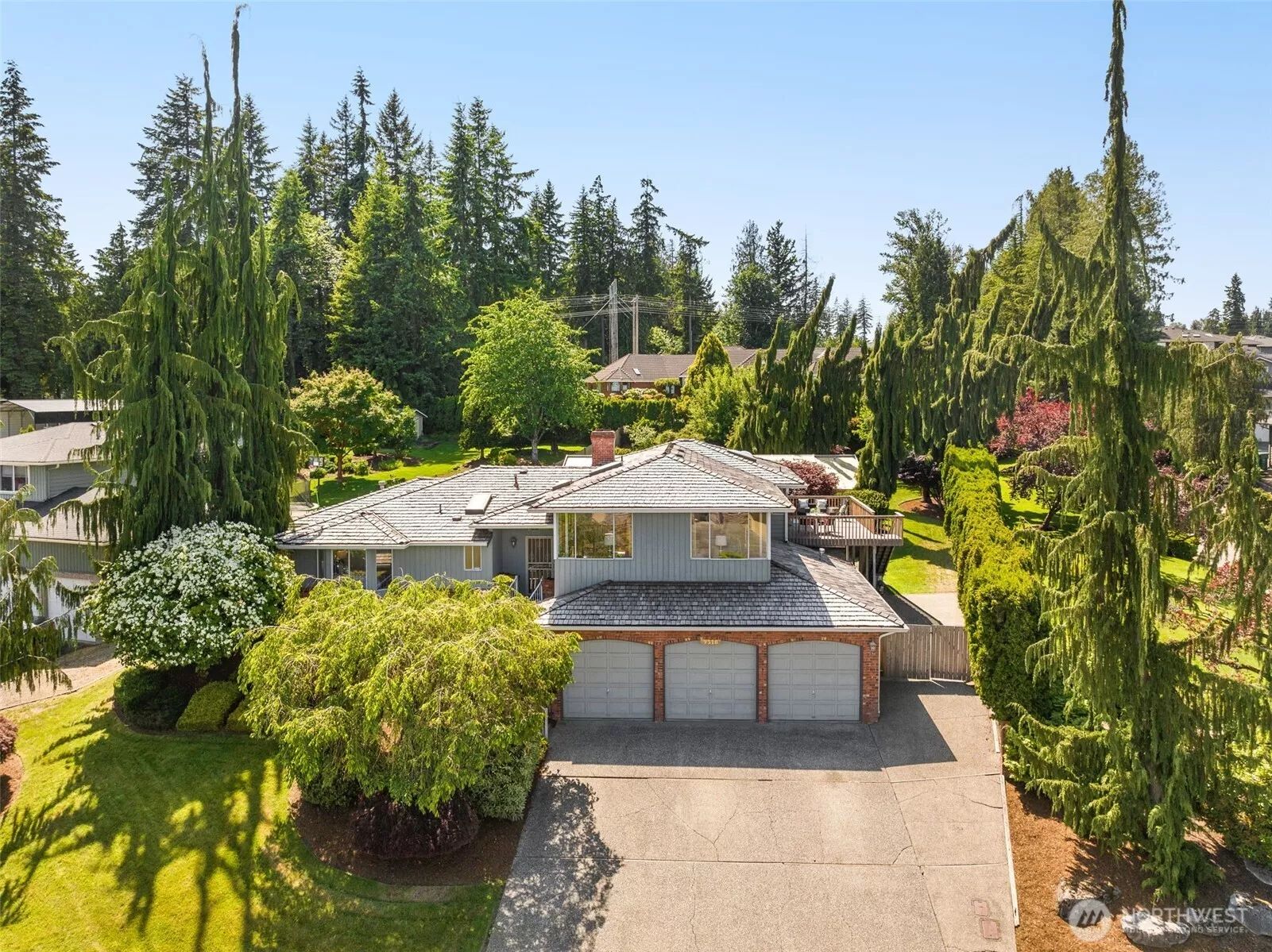 Aerial view of the front of the house, 3 car garage and boat or RV parking!