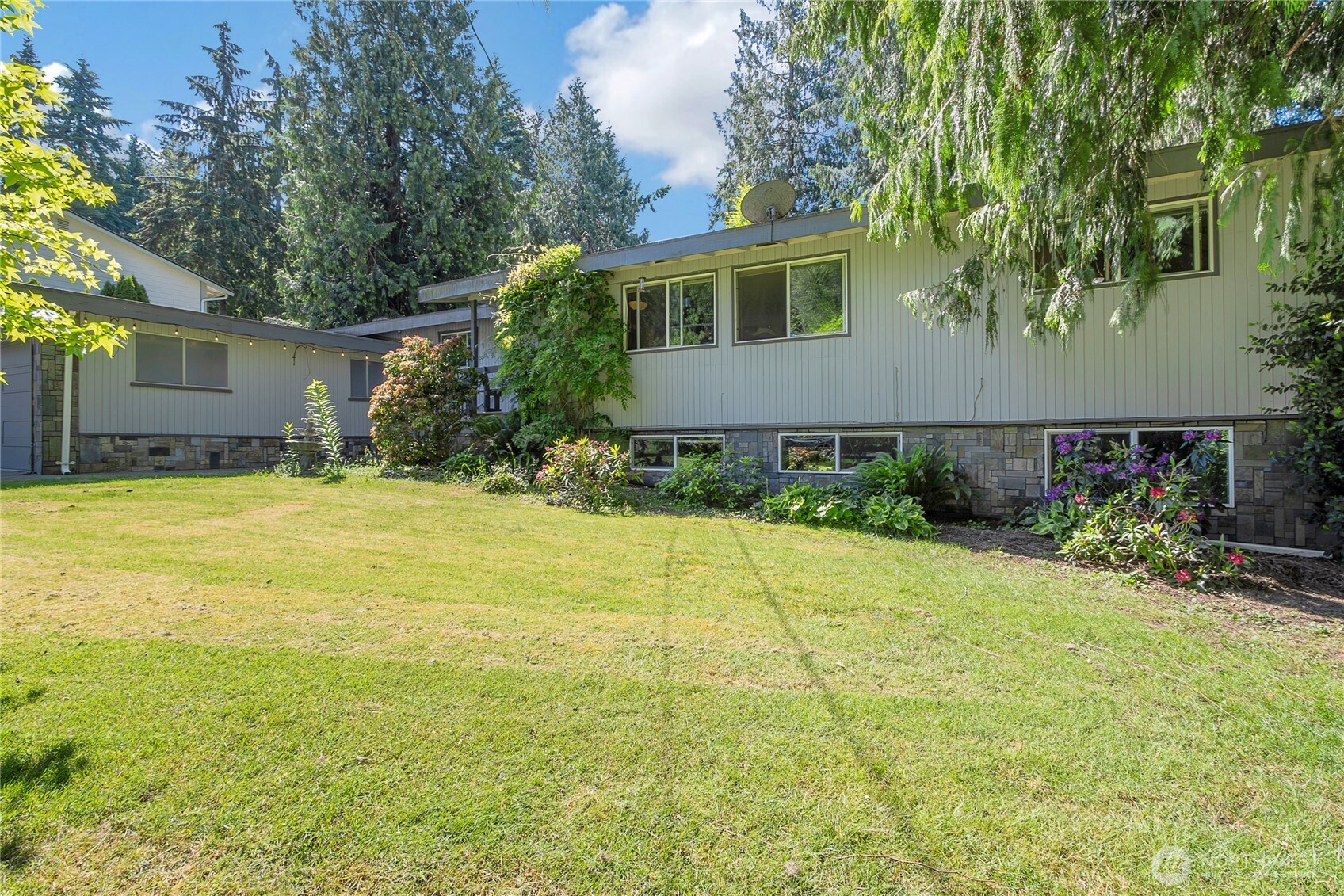 Lush greenery and mature landscaping. Rambler with basement and plenty of storage!