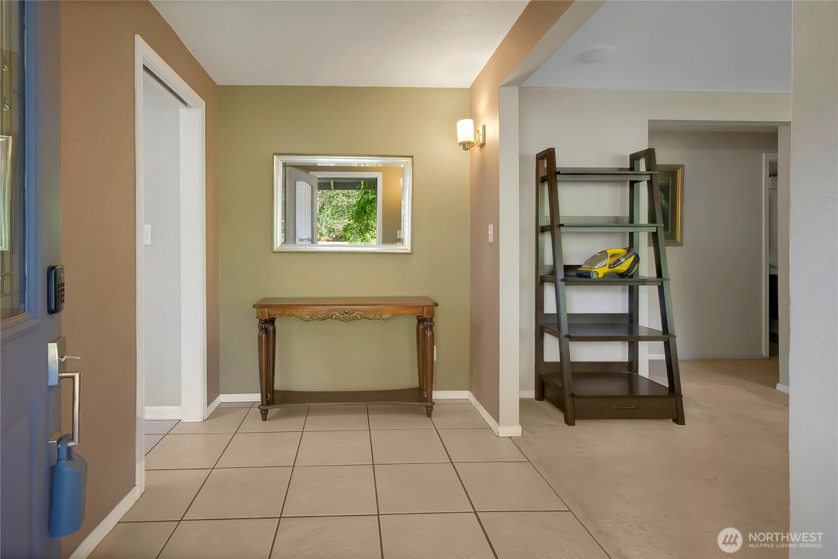 As you enter the home, real tile flooring in the entry and to the left, cushy carpet to your private living room.