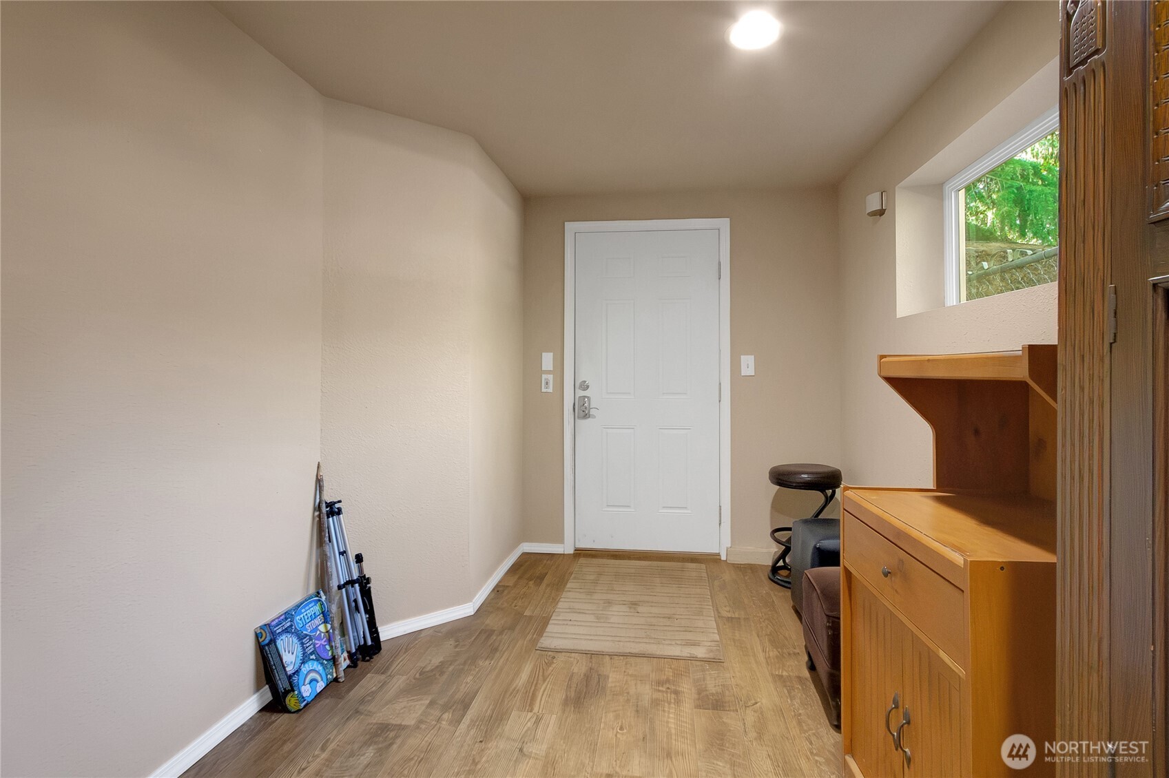 The room leading outside. Could be a small bedroom, mud room or?