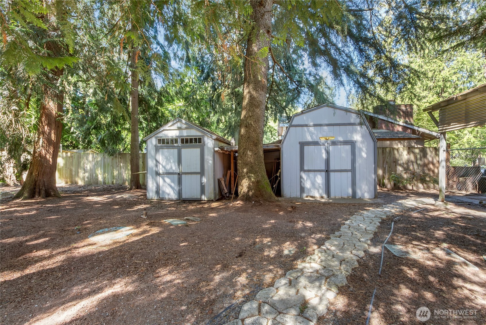 Two out buildings to the right of the property